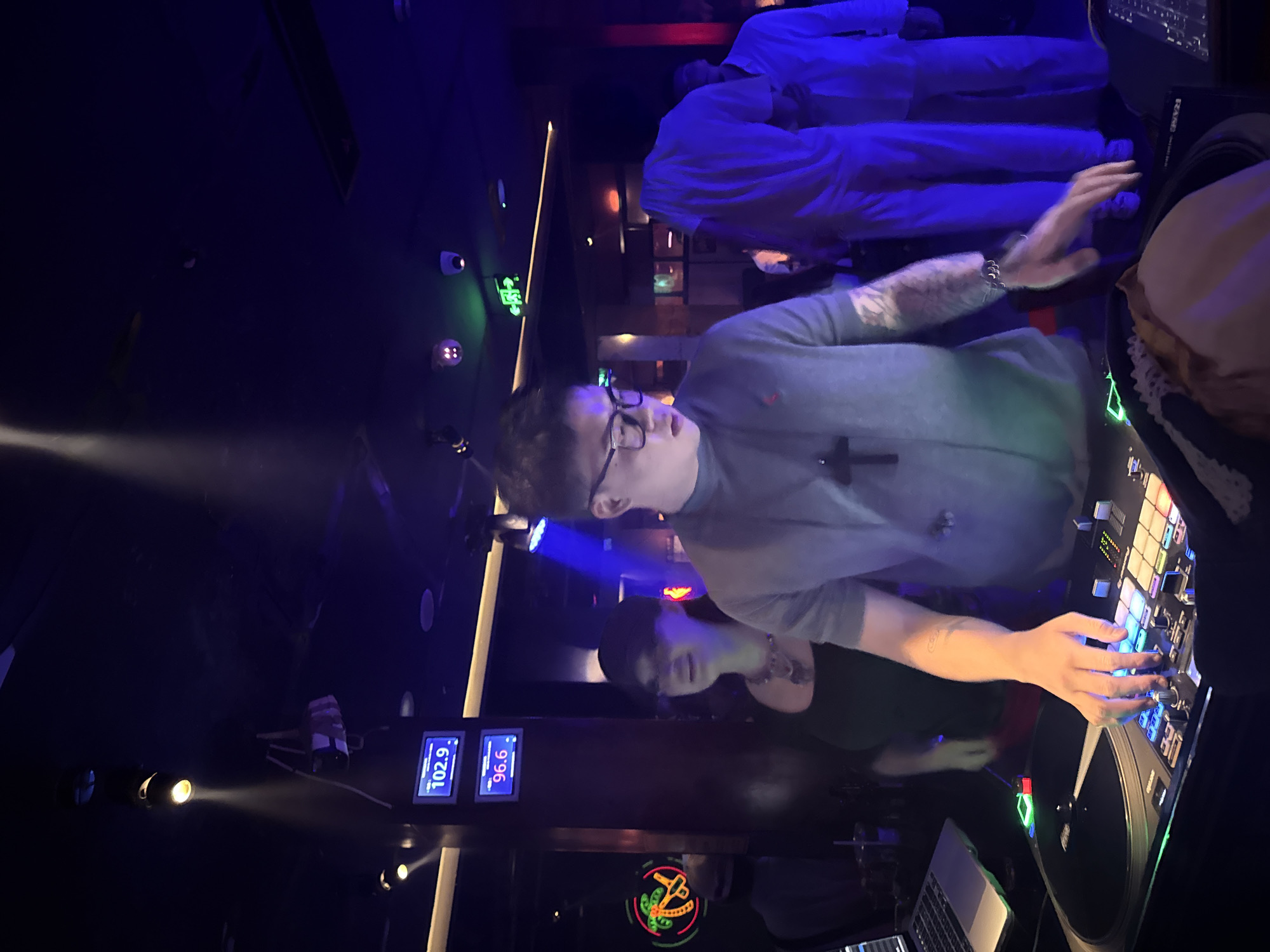 DJ set at Liangjiang nightclub with dancing crowd