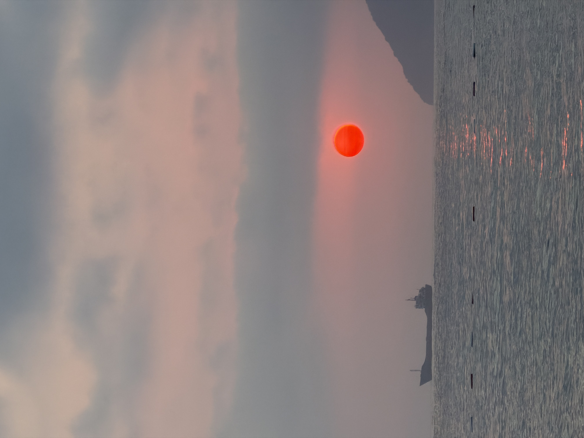 Cargo ship silhouetted against an Adriatic sunset near Bar