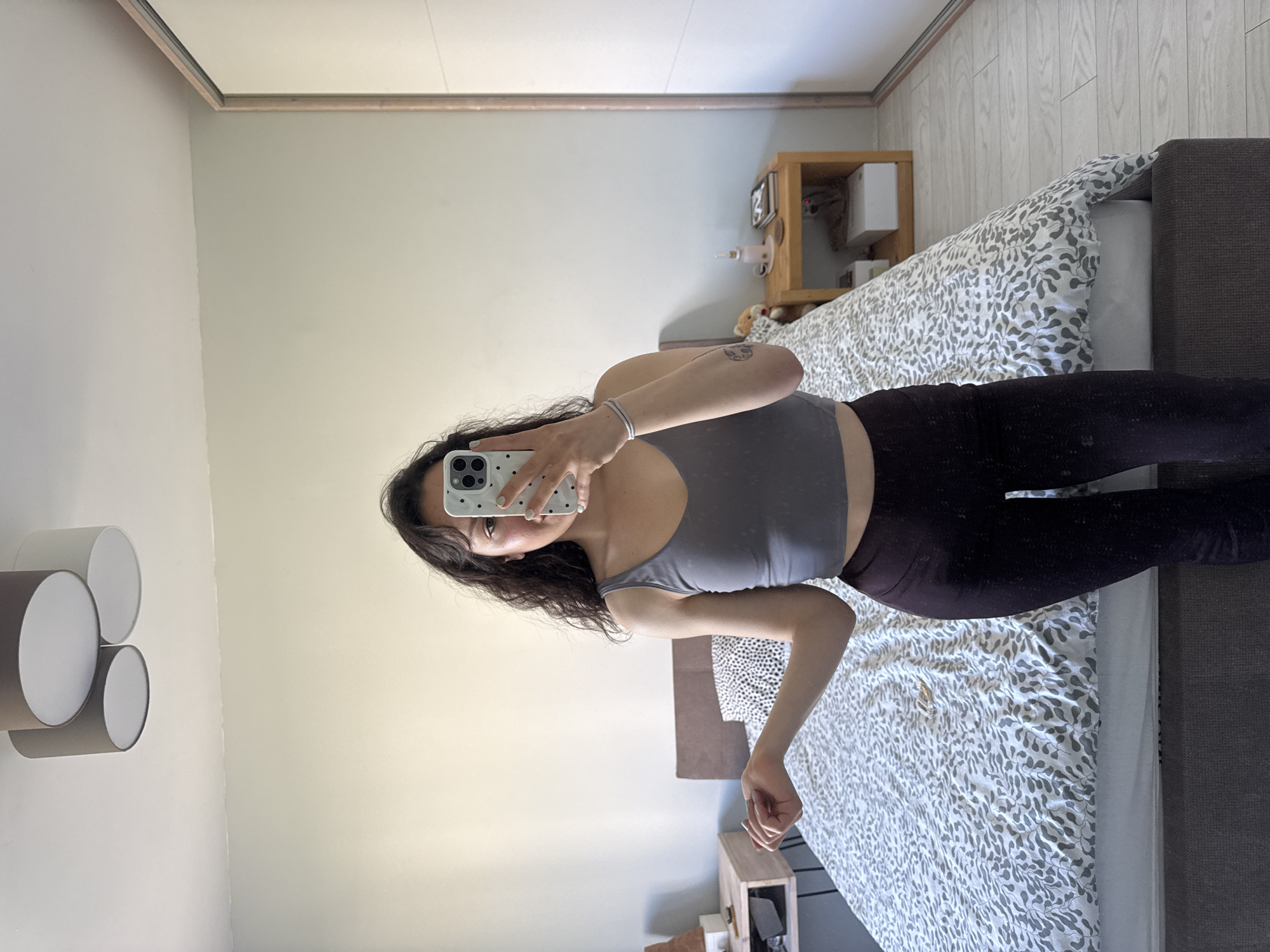 Woman's morning selfie session documented in Burgas bedroom