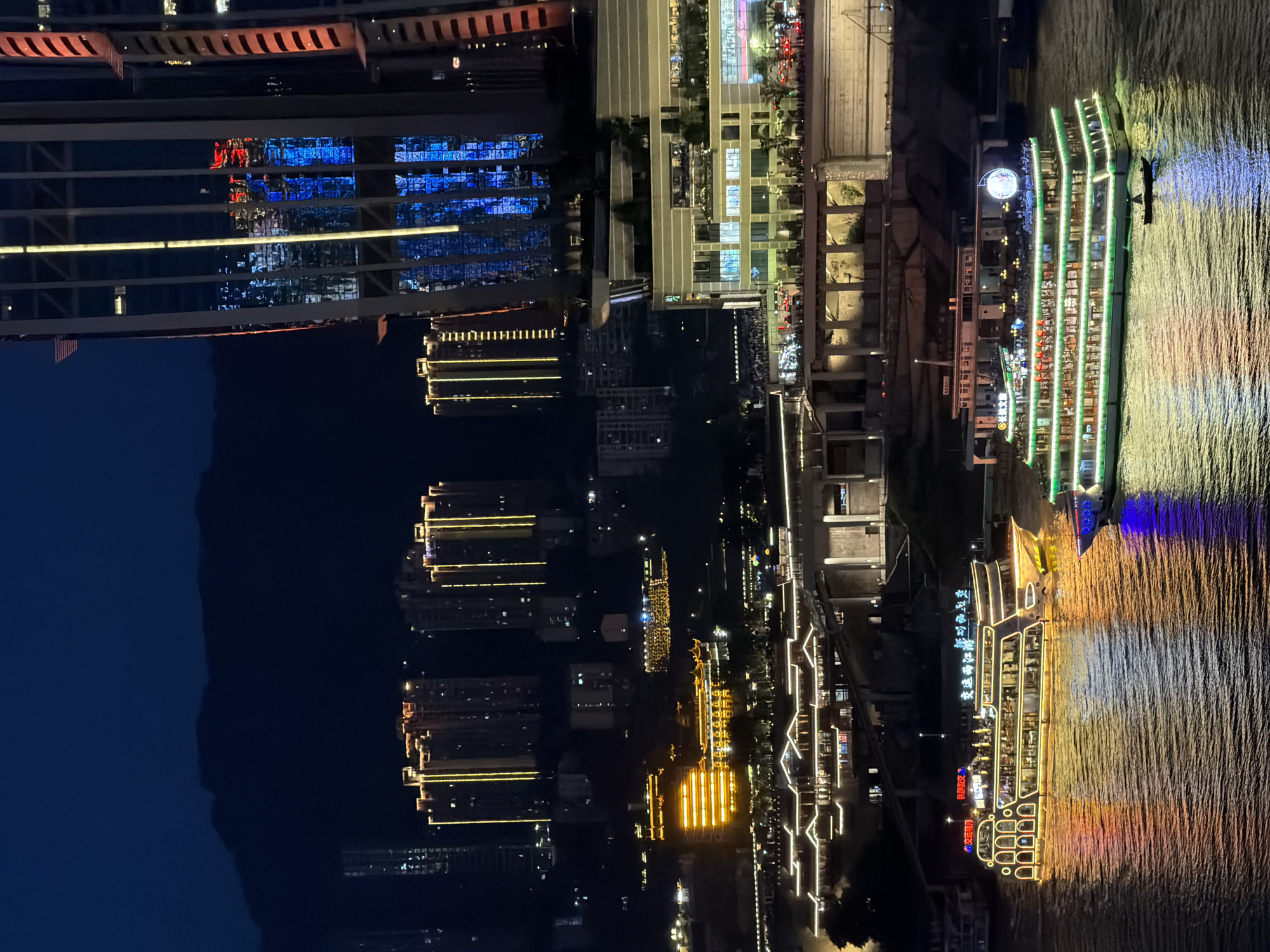 Chongqing's neon-lit waterfront and streets after dark