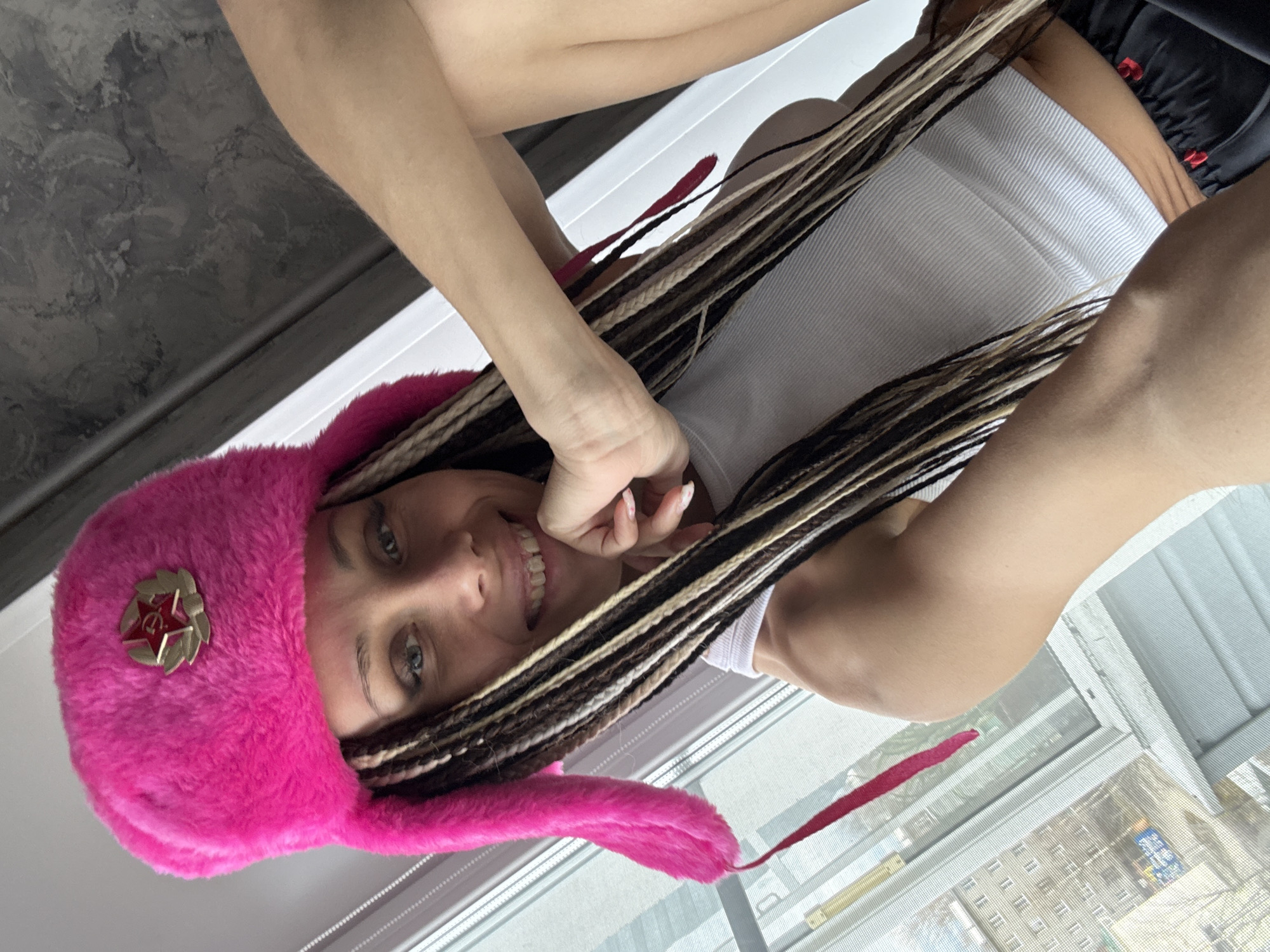 Woman in Soviet ushanka takes selfie in Yaroslavl