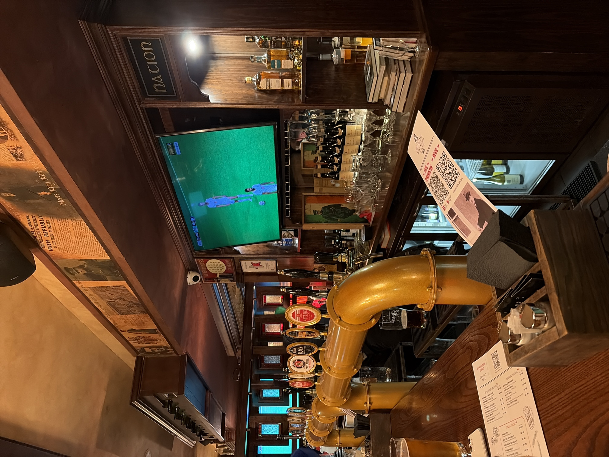 Evening at a Moscow Irish pub, beer taps and all