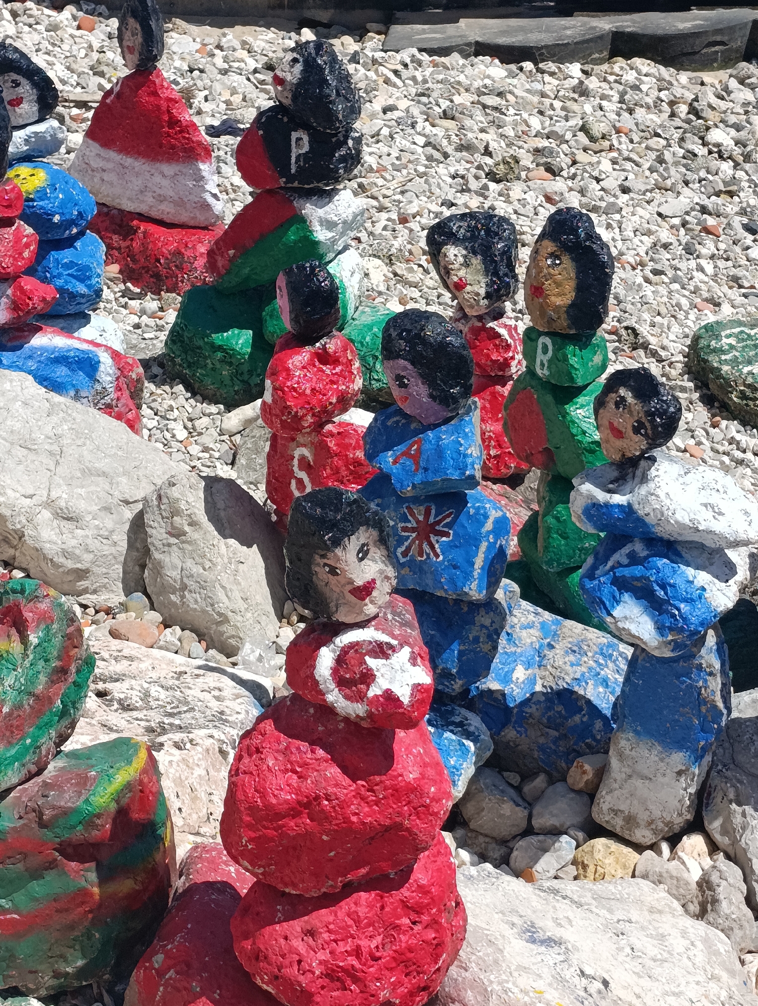 Lisbon waterfront alive with art, ferries, and afternoon crowds