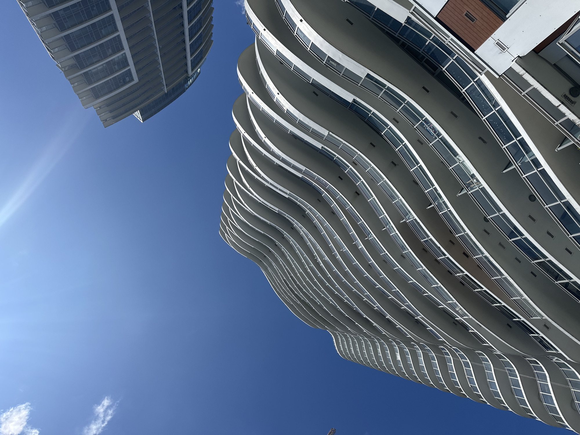 Wave-shaped condo and rope-access work in Surrey