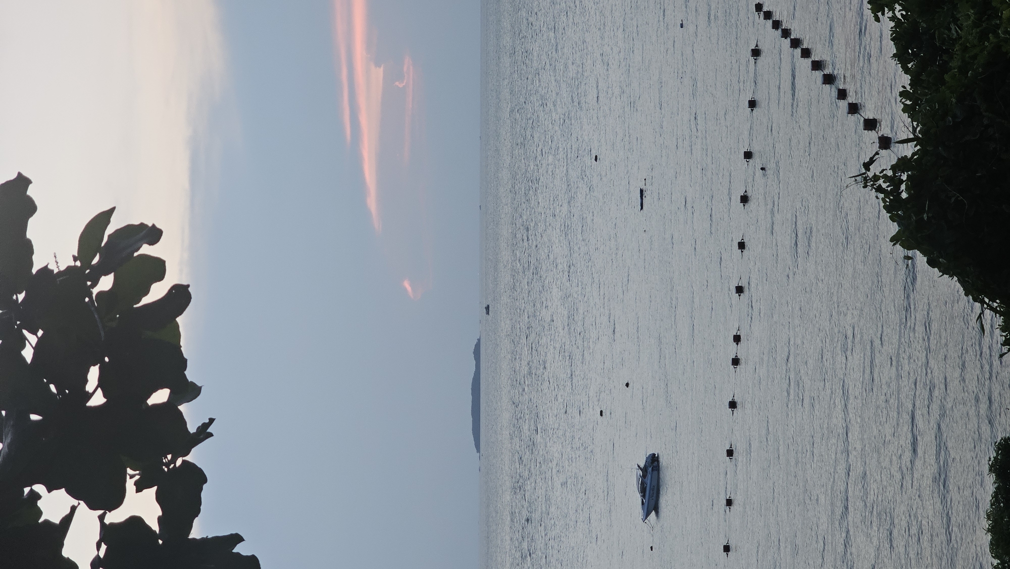 Tourist documents sunset dining experience in Pattaya, Thailand