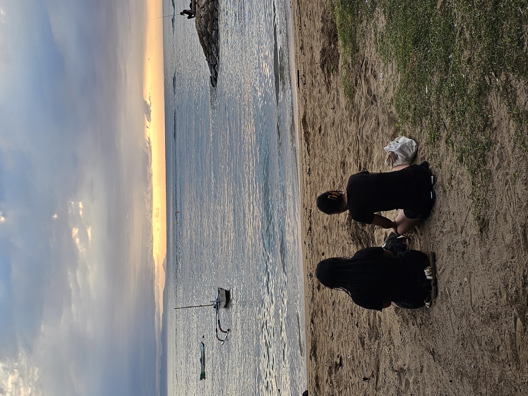 Evening beach gathering observed in Denpasar during sunset