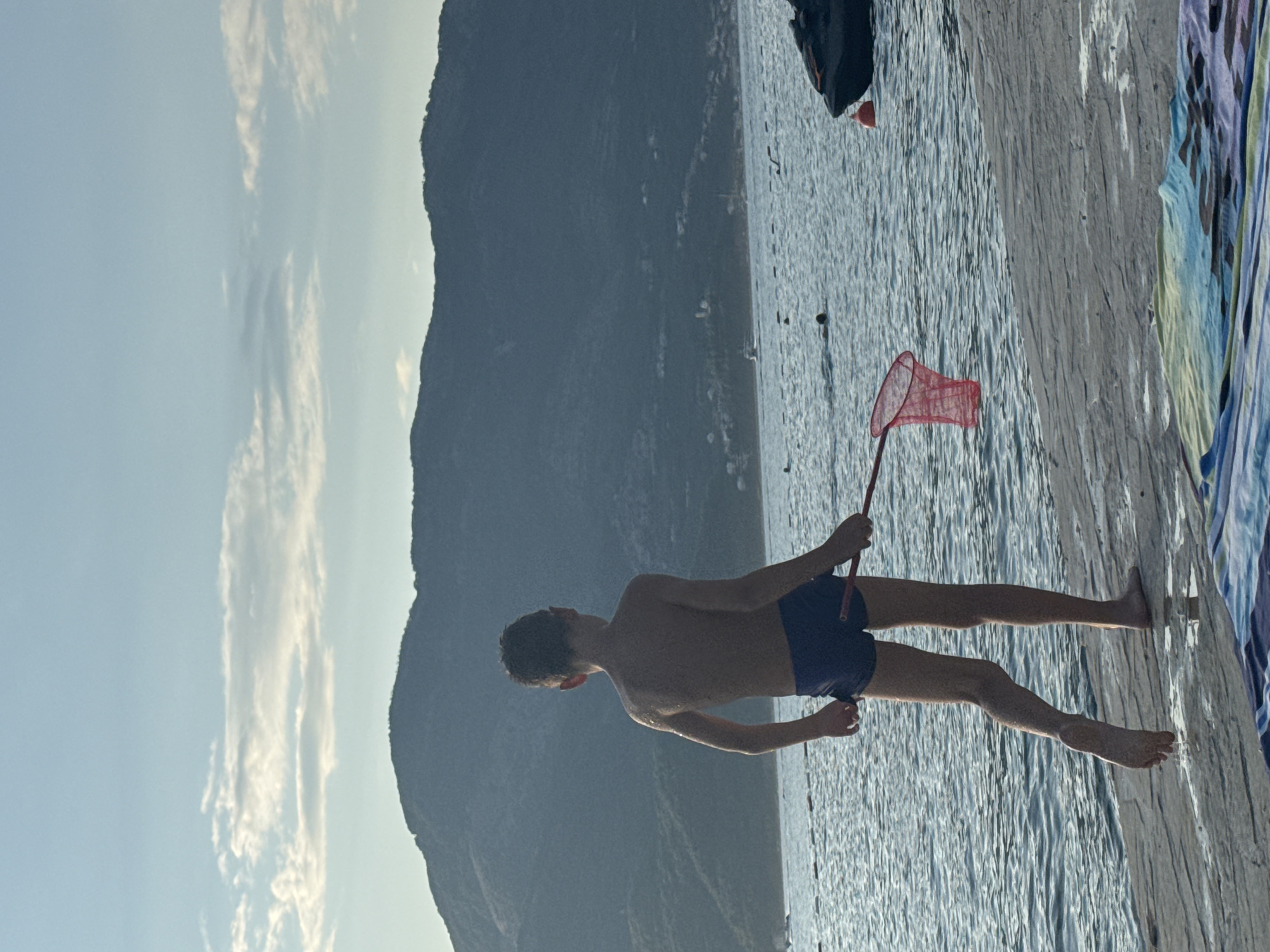 Lazy beach afternoon with snorkeling, lounging, and golden-hour light.