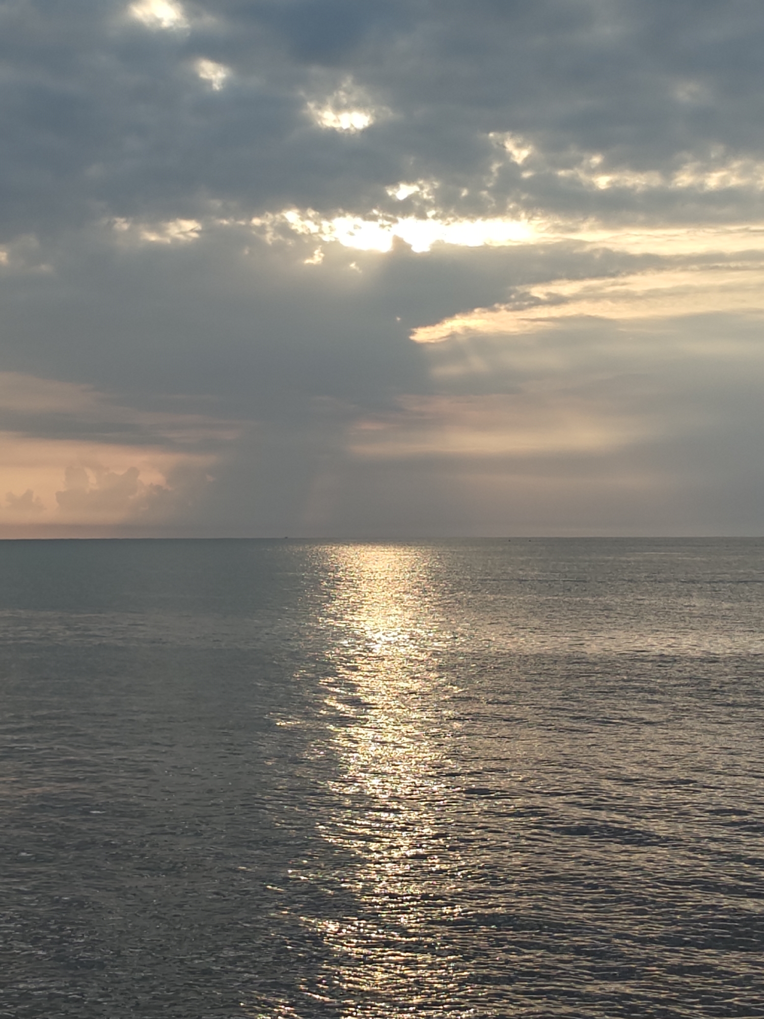 Rocky shoreline at dusk, Lhokseumawe coast