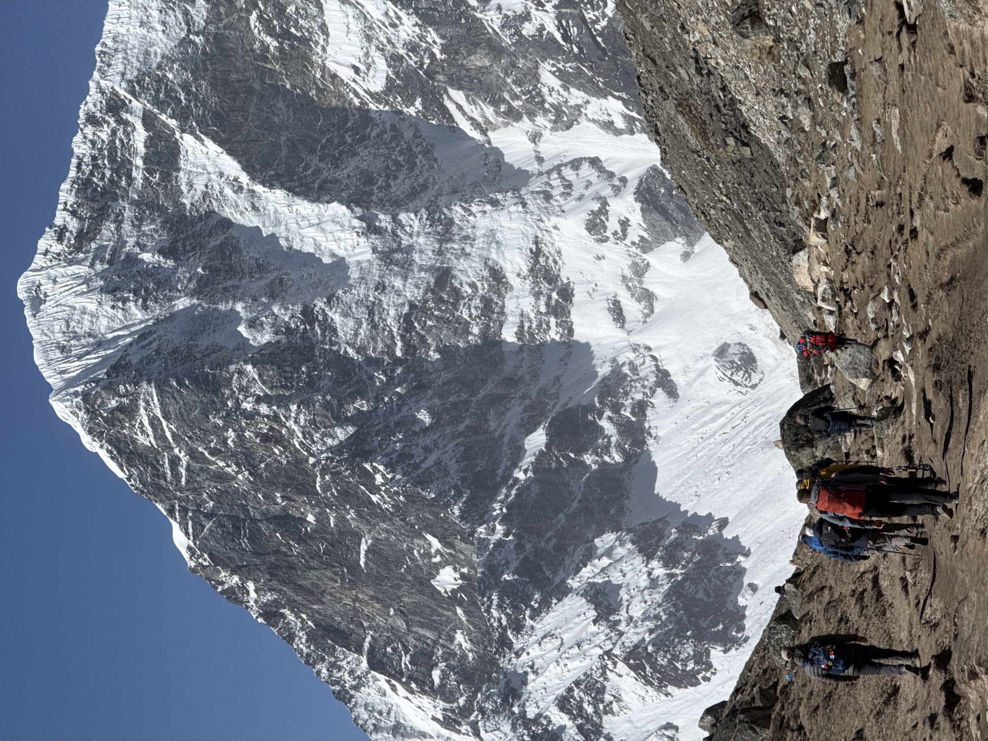 Trekking group spotted on mountain trail in Khumjung, Nepal