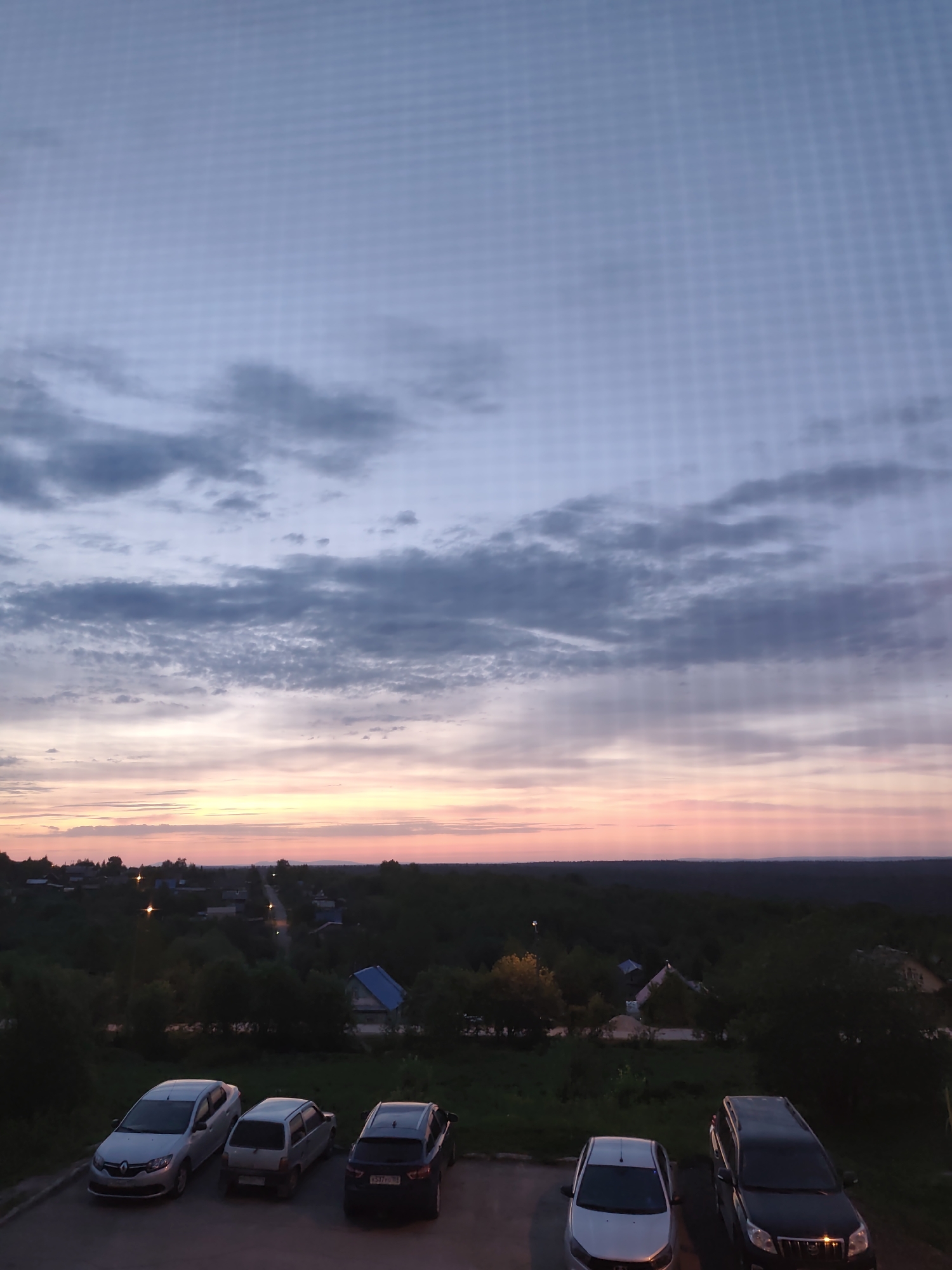 Quiet dusk evening captured across residential Gremyachinsk, Russia