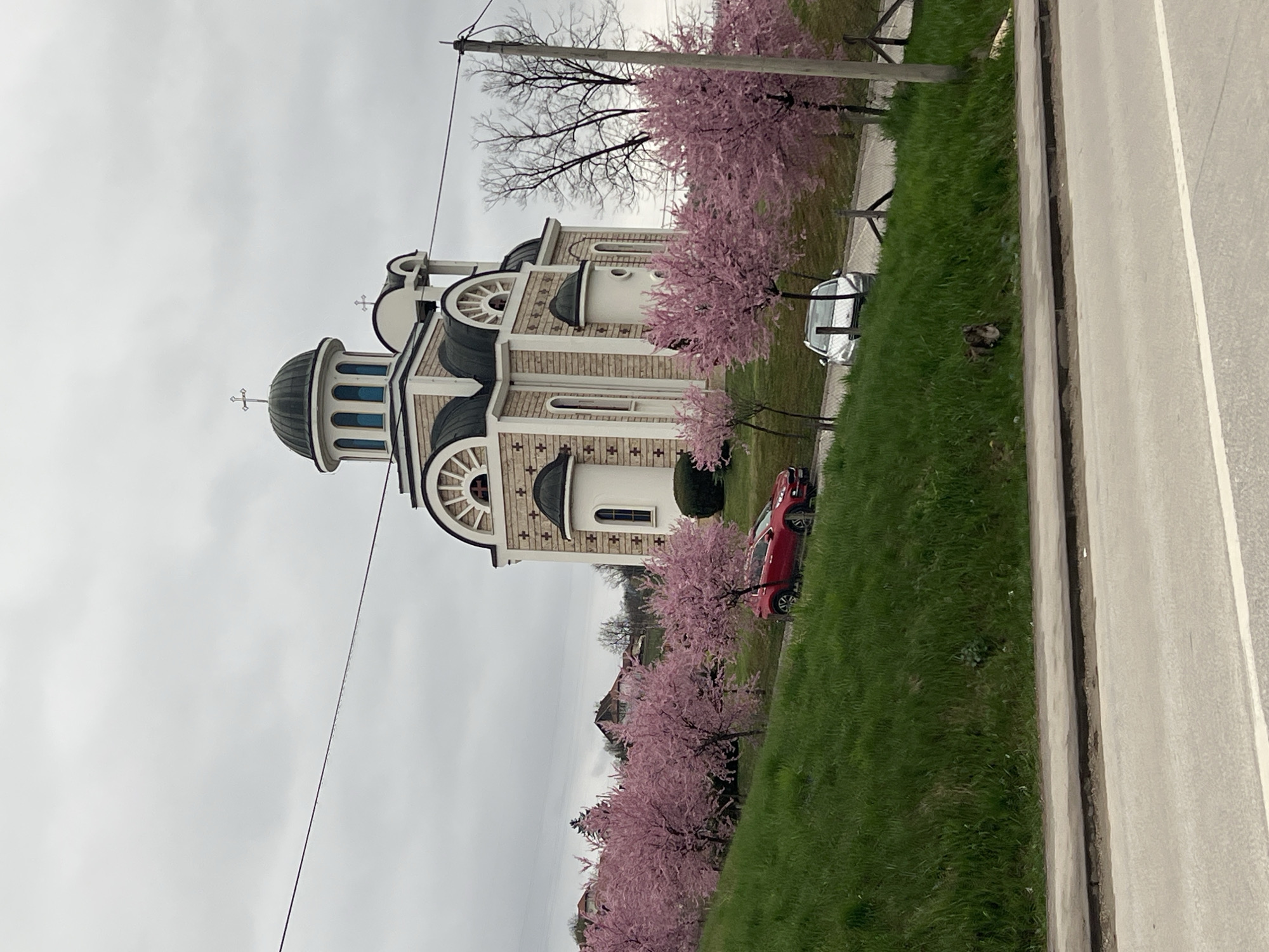 Spring blossoms frame historic church in Cacak, Serbia
