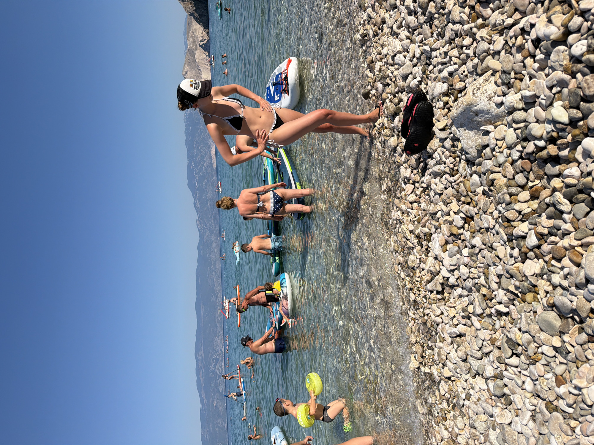 Sunny afternoon on the pebble beaches of Baška, Croatia