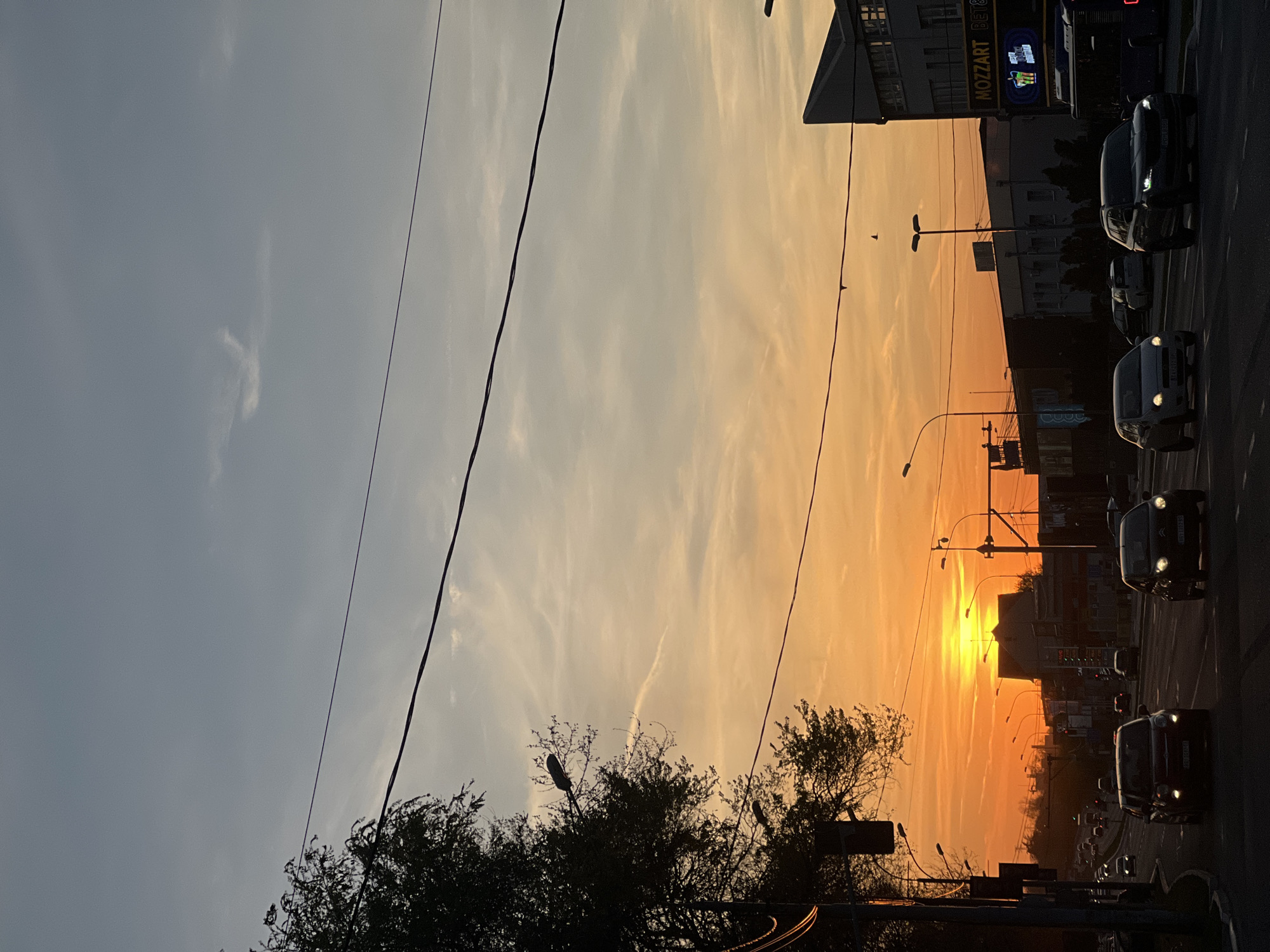 Evening traffic scene captured at sunset in Belgrade suburb