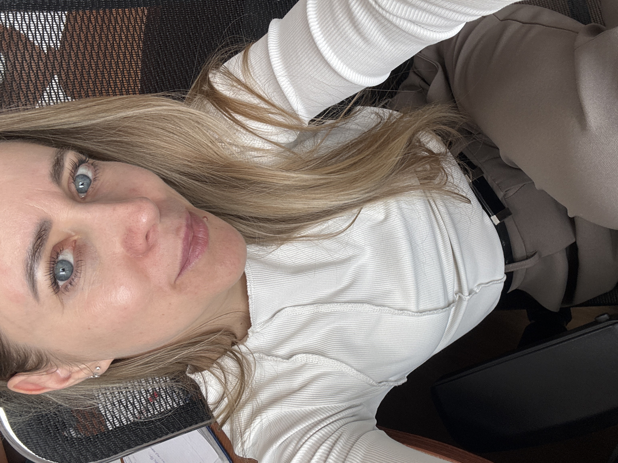Woman photographed in office setting in Chaikovsky, Russia