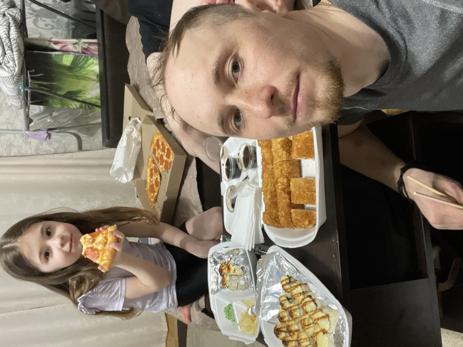 Family meal shared in domestic setting in Лубянки, Russia