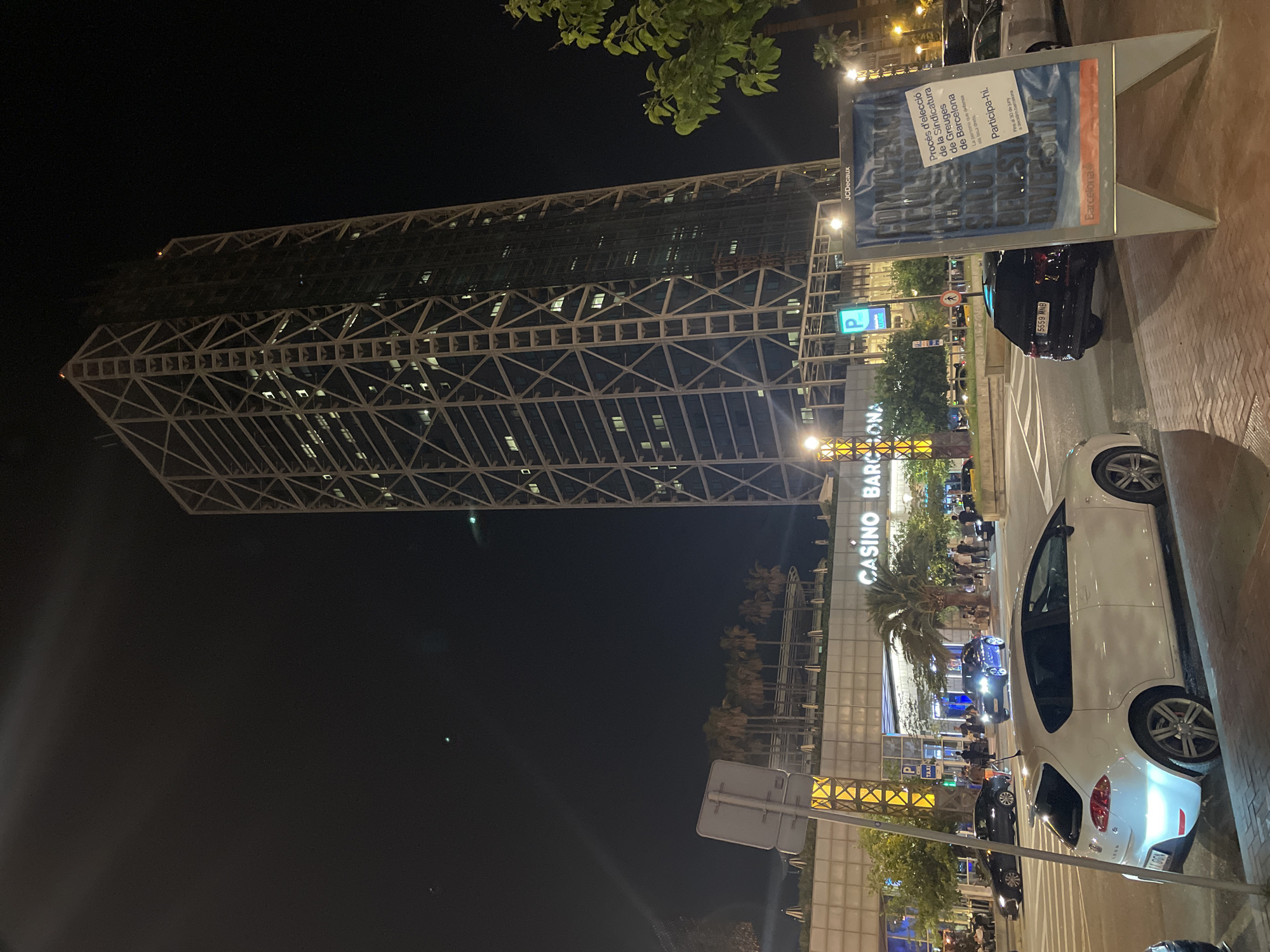 Barcelona Port Olímpic nightlife draws crowds around illuminated landmarks