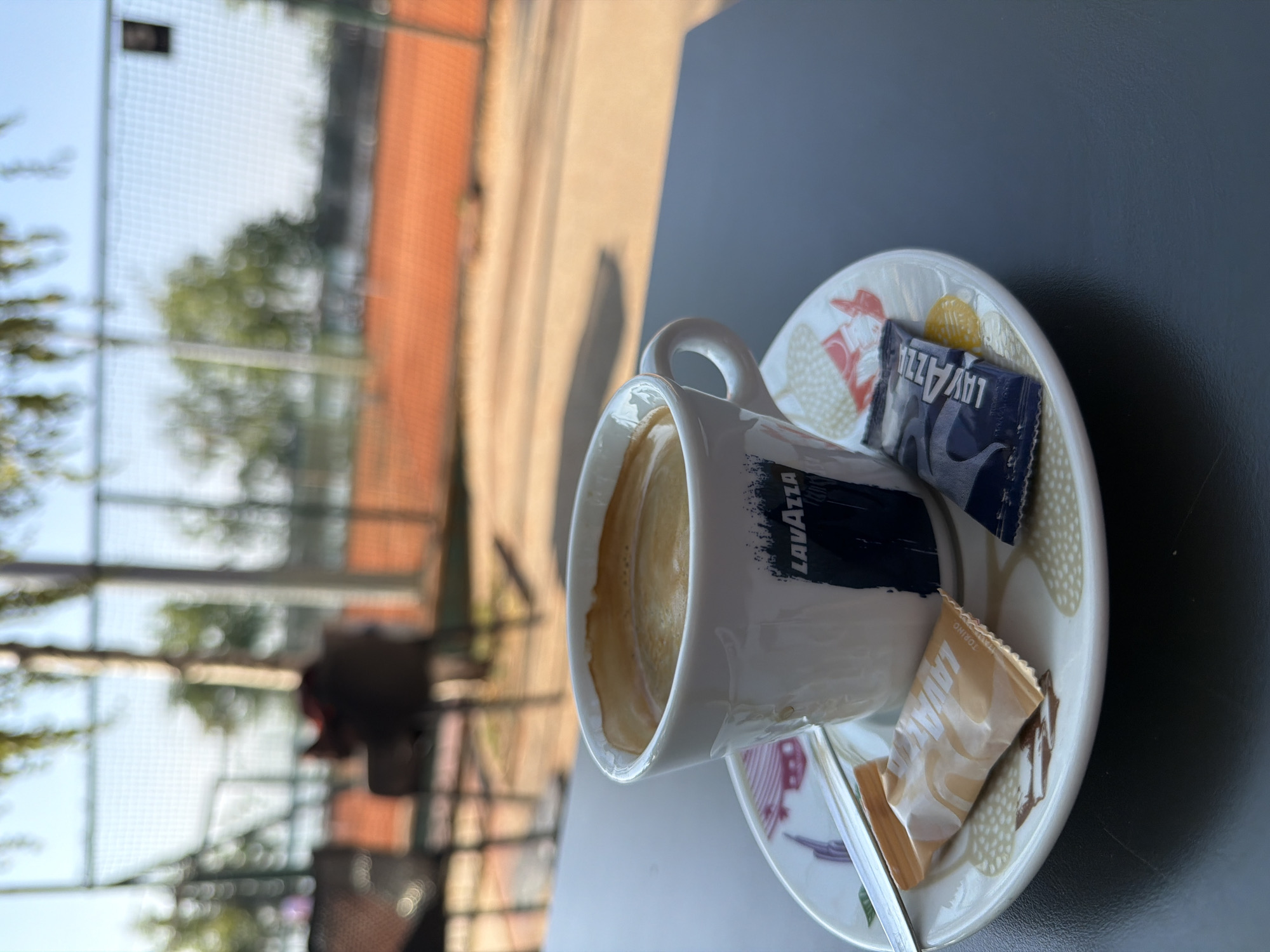 Lavazza espresso and sugar packets on a Belgrade café saucer