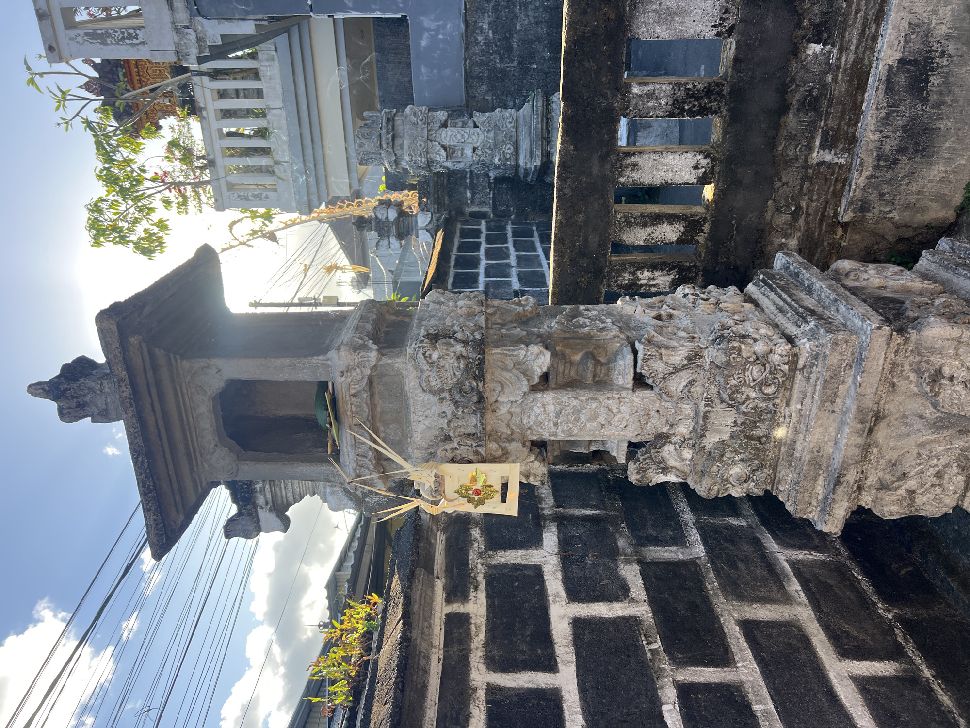 Denpasar street life: shrines, cats, kites, and offerings