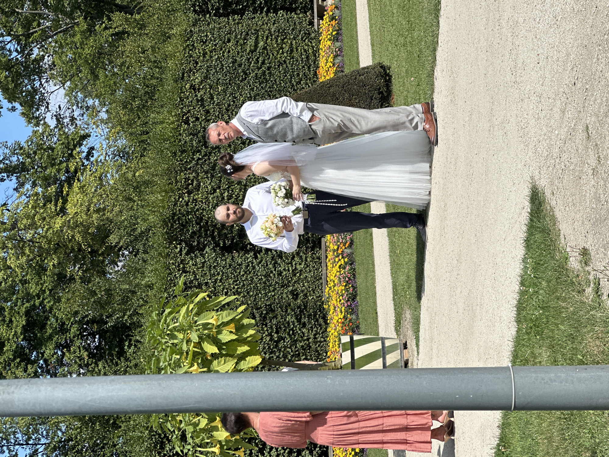 Wedding party tours Warsaw's grand palace gardens on a sunny day