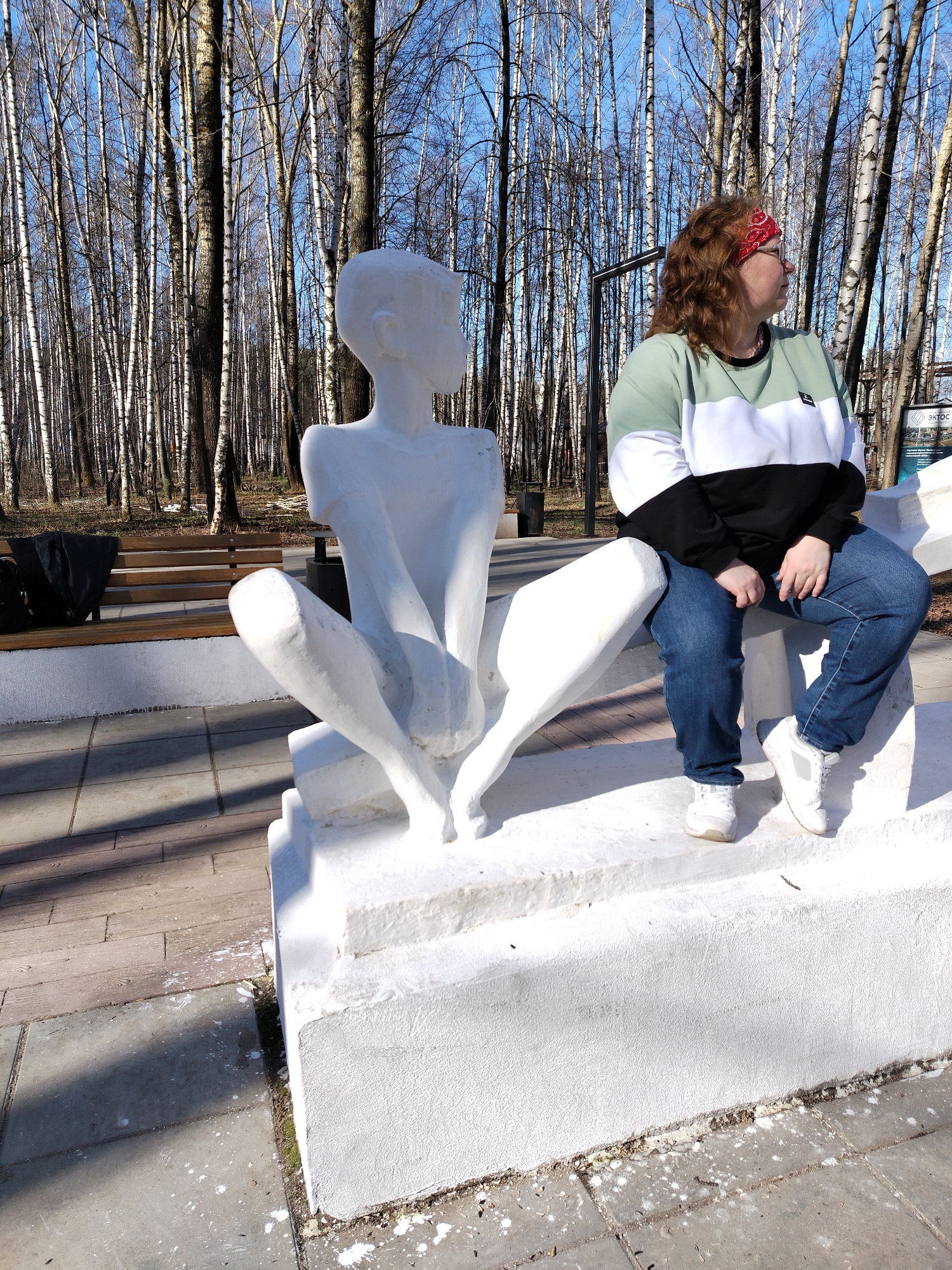 Woman dances, poses with sculptures in Chaikovsky park