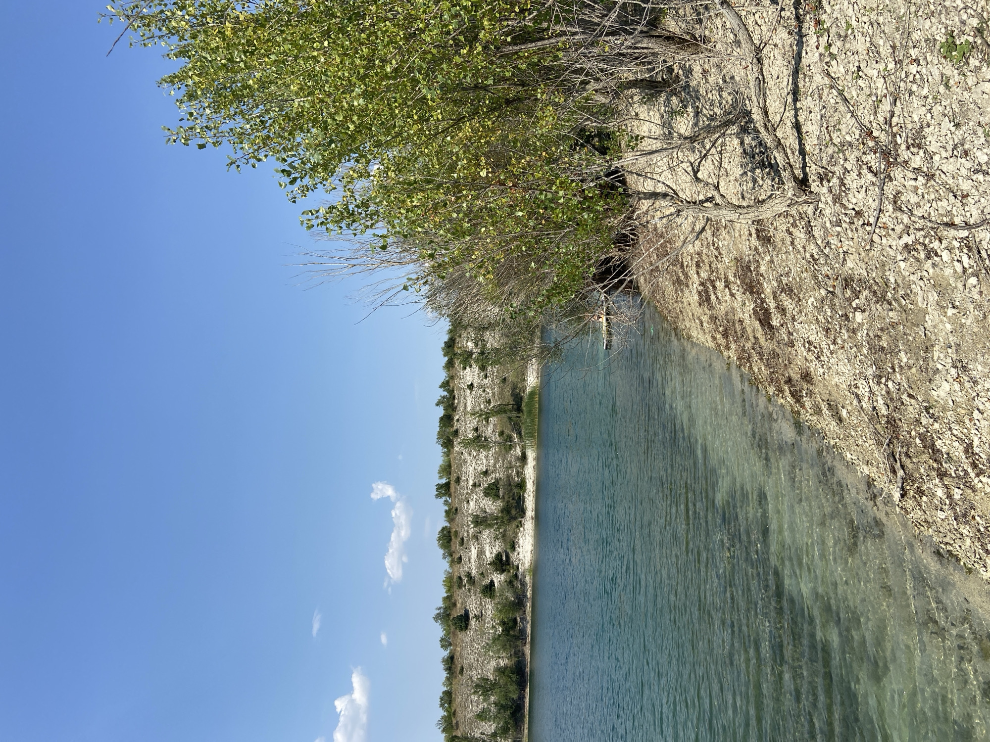Lazy summer afternoon at a turquoise quarry lake in Crimea