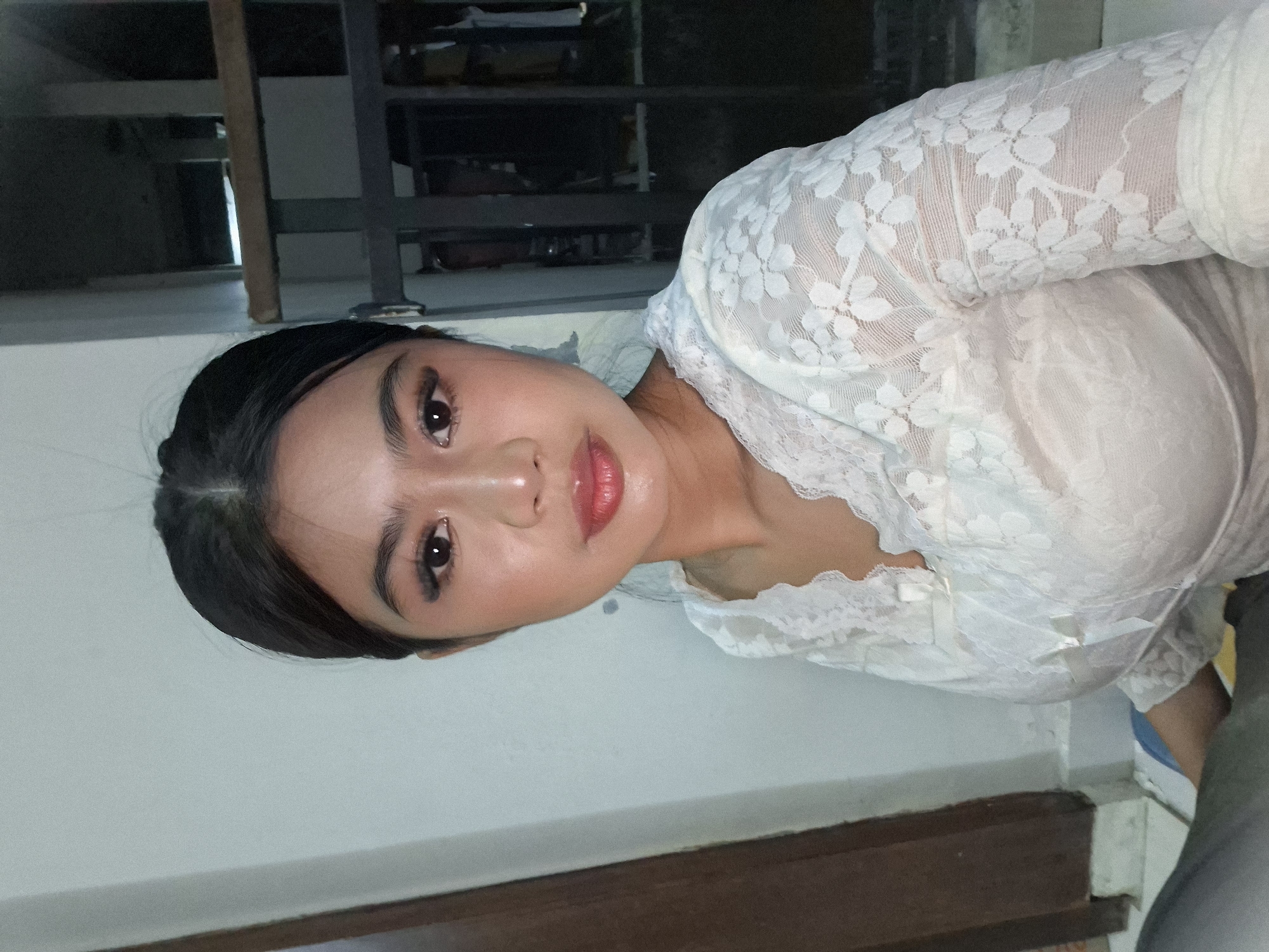 Selfie session in a Kuta room, white lace and playful poses