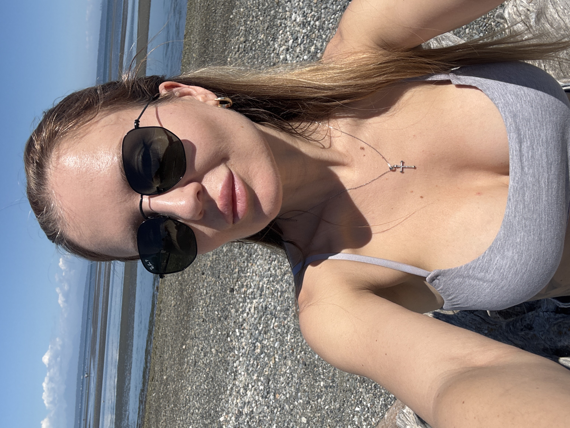 Selfie on a calm pebble beach in Delta, Canada