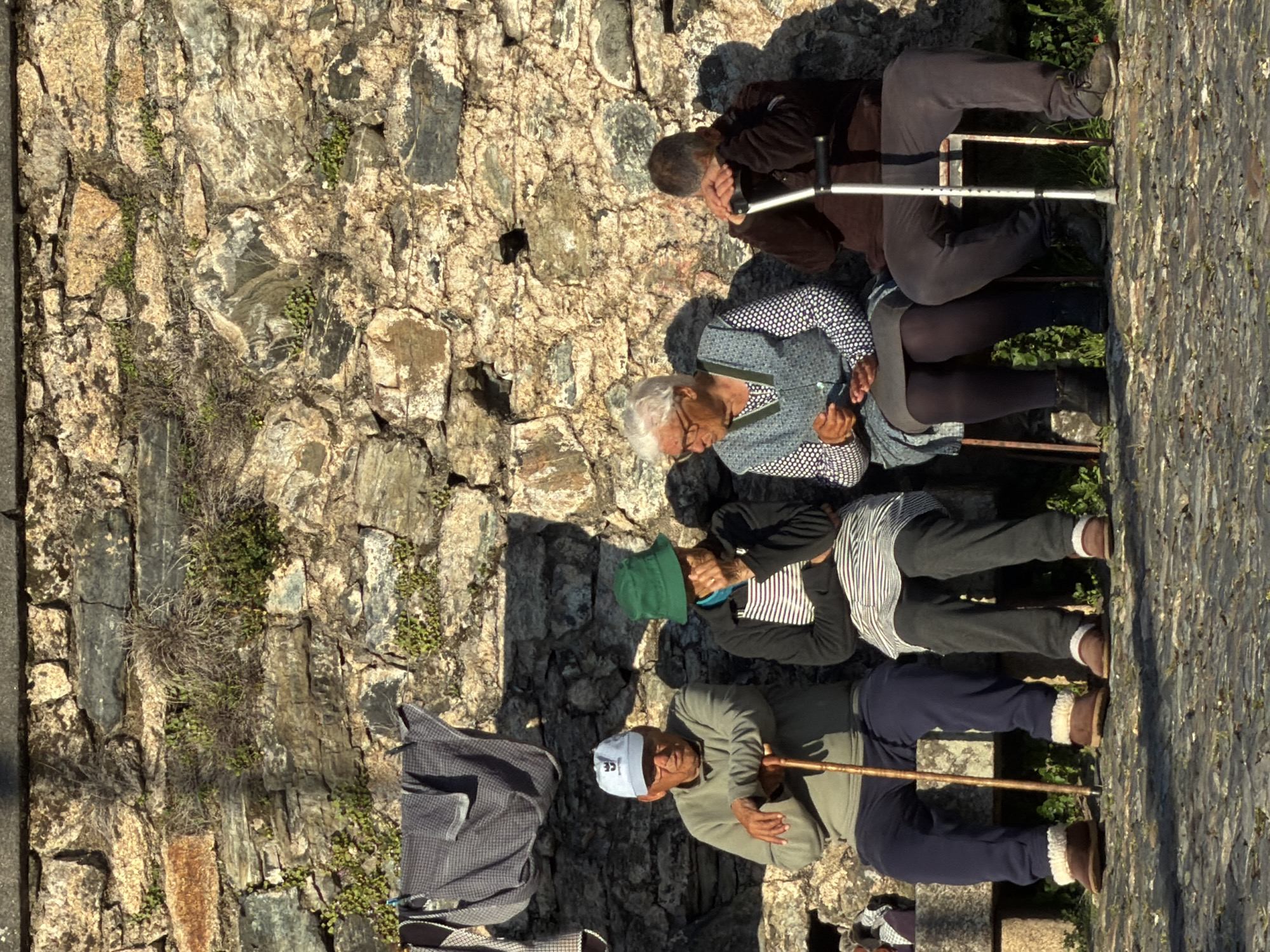 Afternoon tourists explore historic Bragança, Portugal walkways and attractions