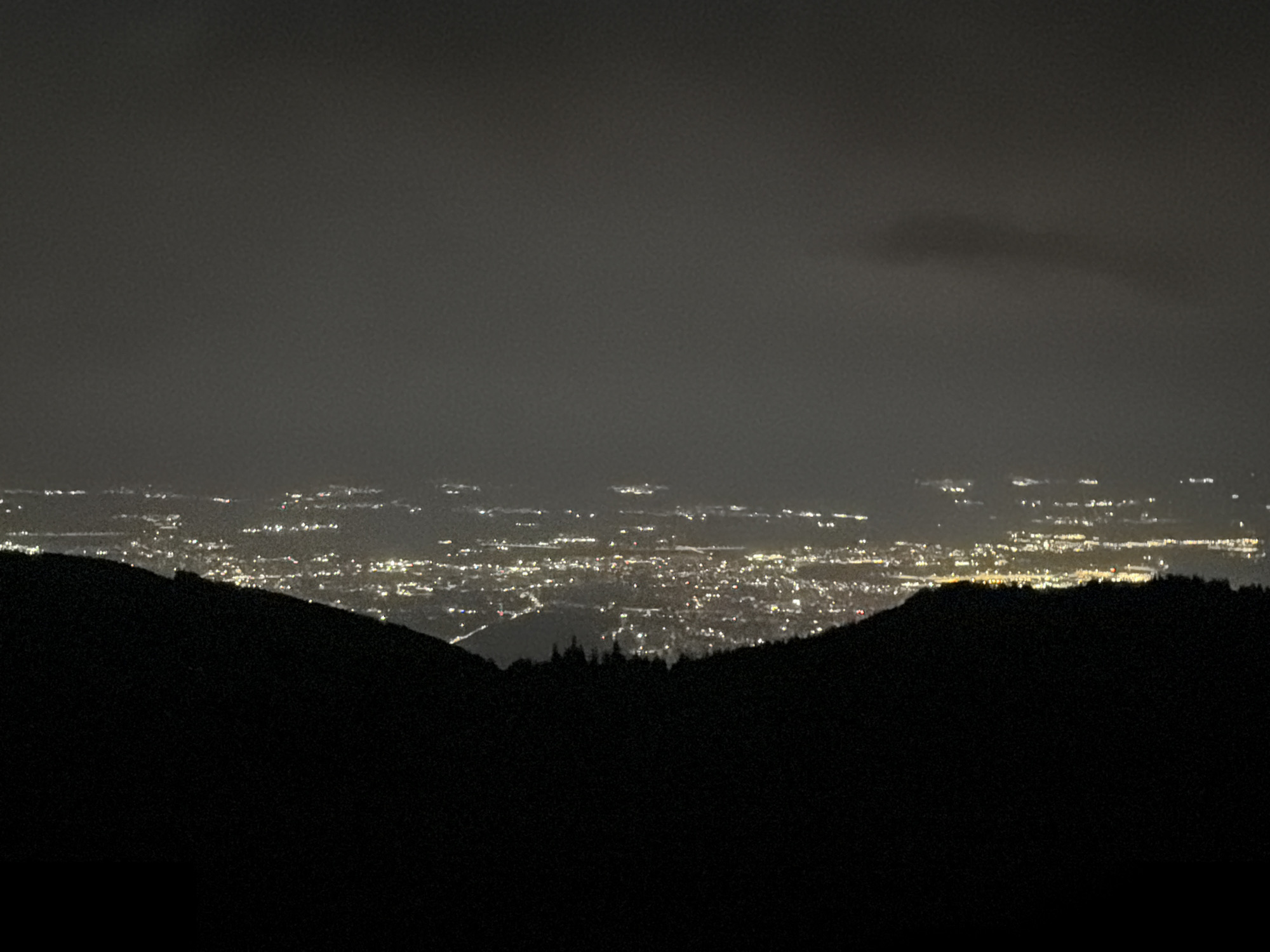 Moonlit hillside gathering above Sofia's glowing nightscape