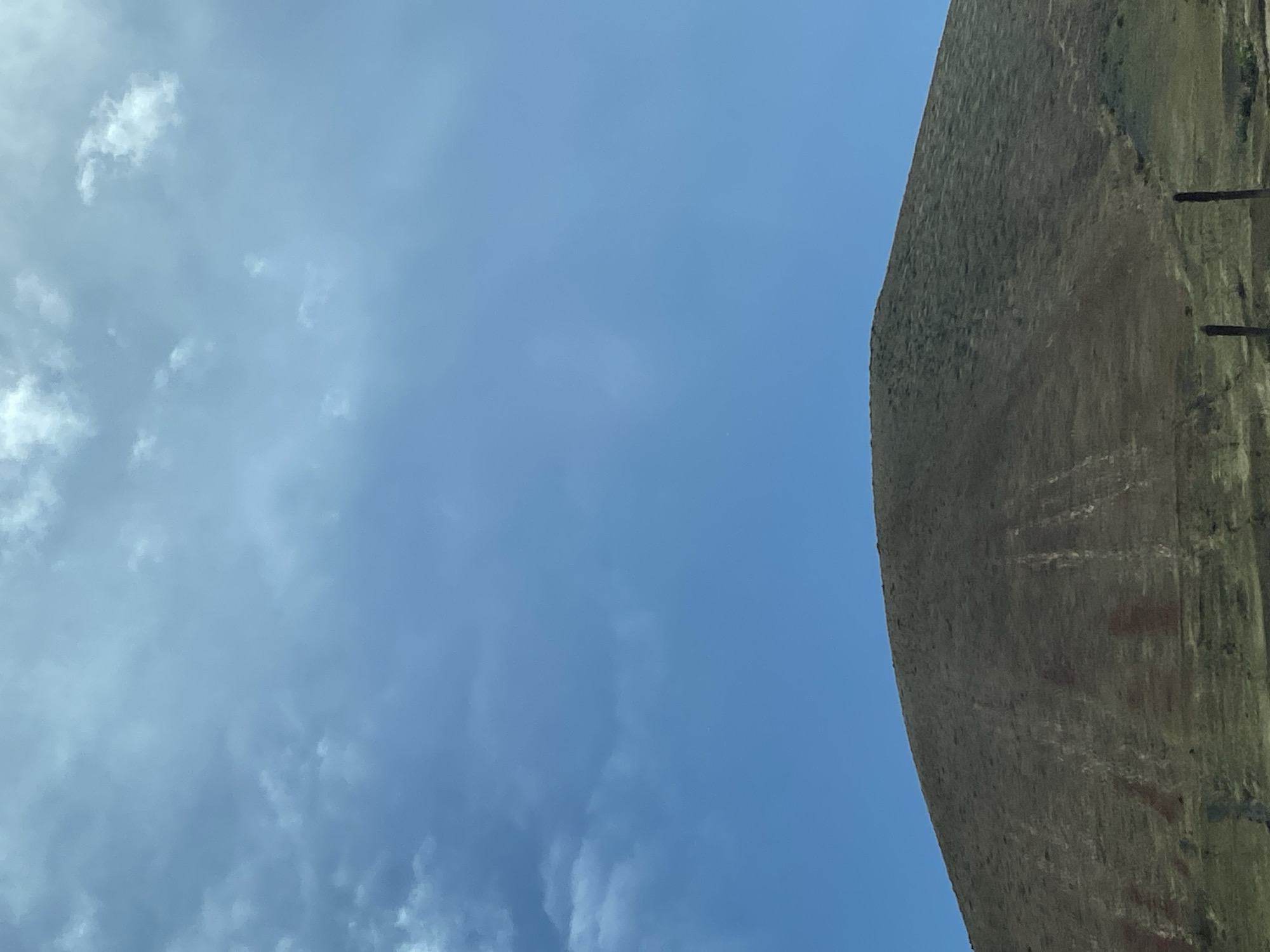 Hill or stone structure observed under cloudy sky in Yaiza