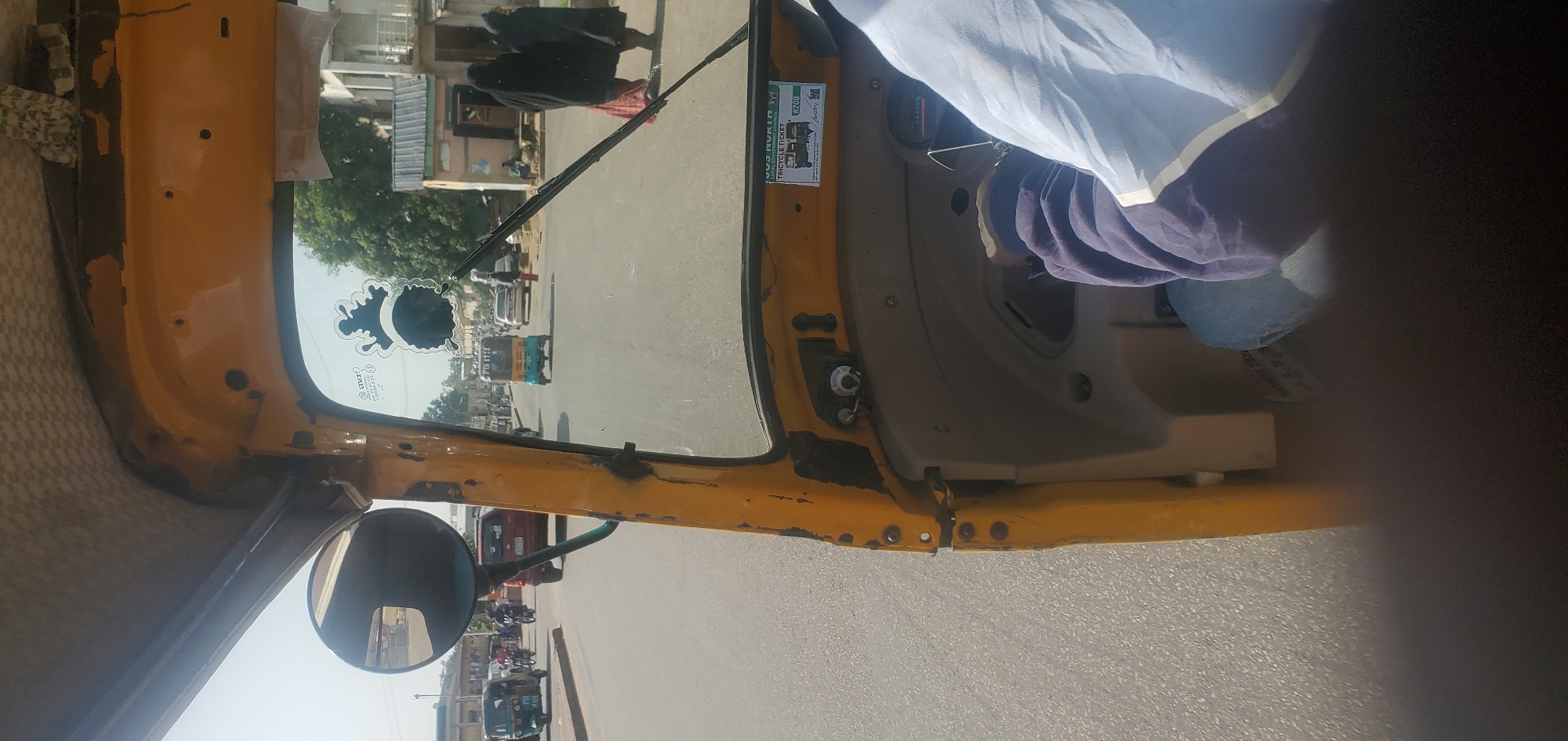 Midday street life and traffic across Jos, Nigeria