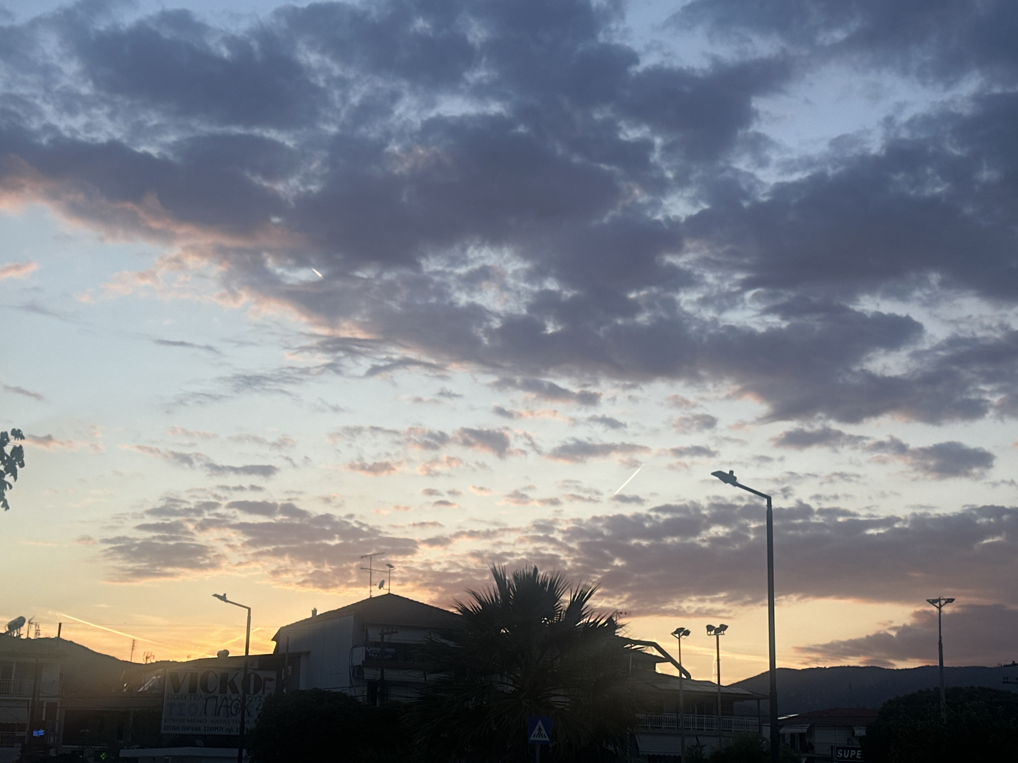 Community celebration and sunset scenes in coastal Stavros, Greece