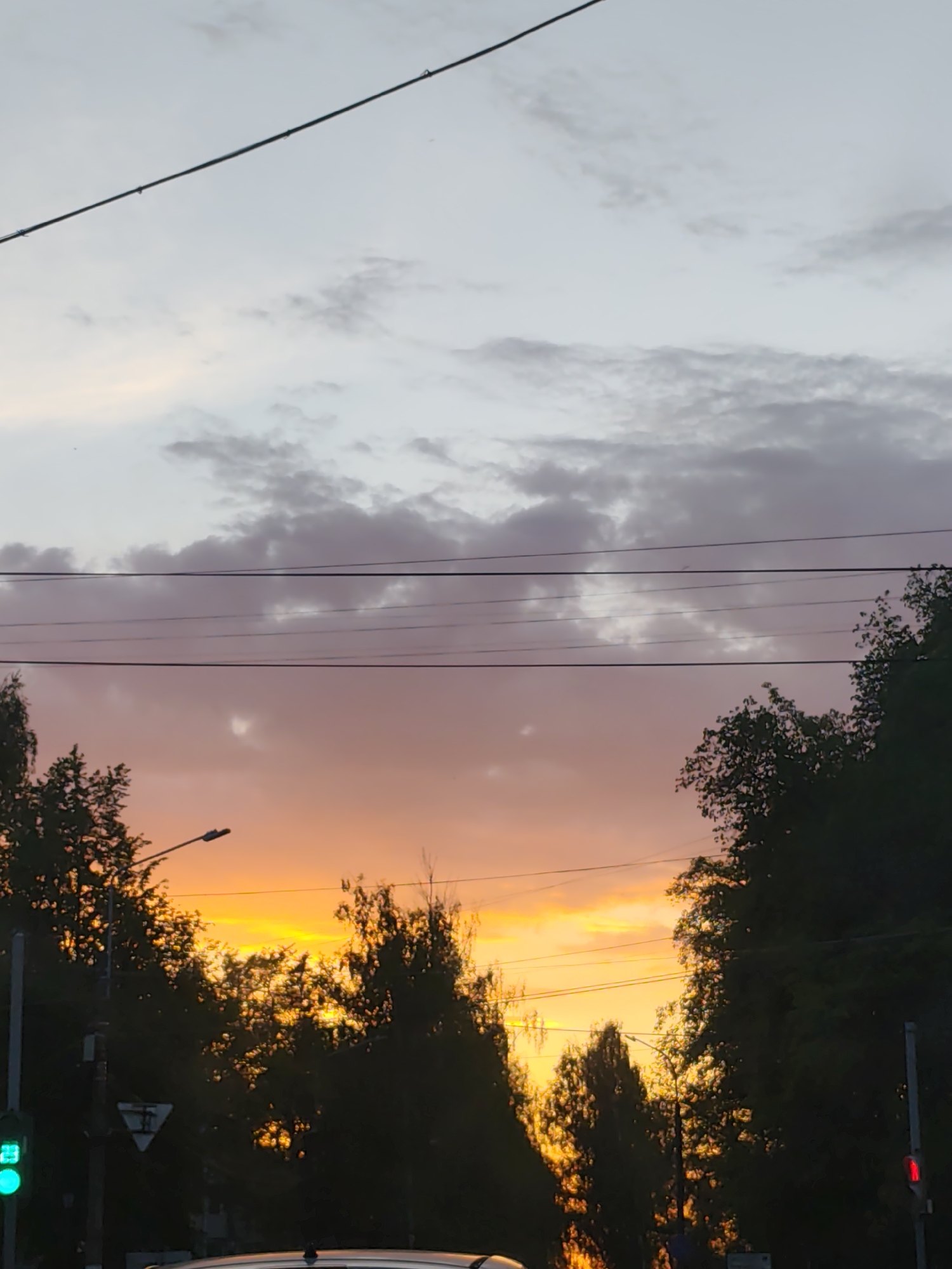 Evening life unfolds in Chaikovsky during spectacular sunset