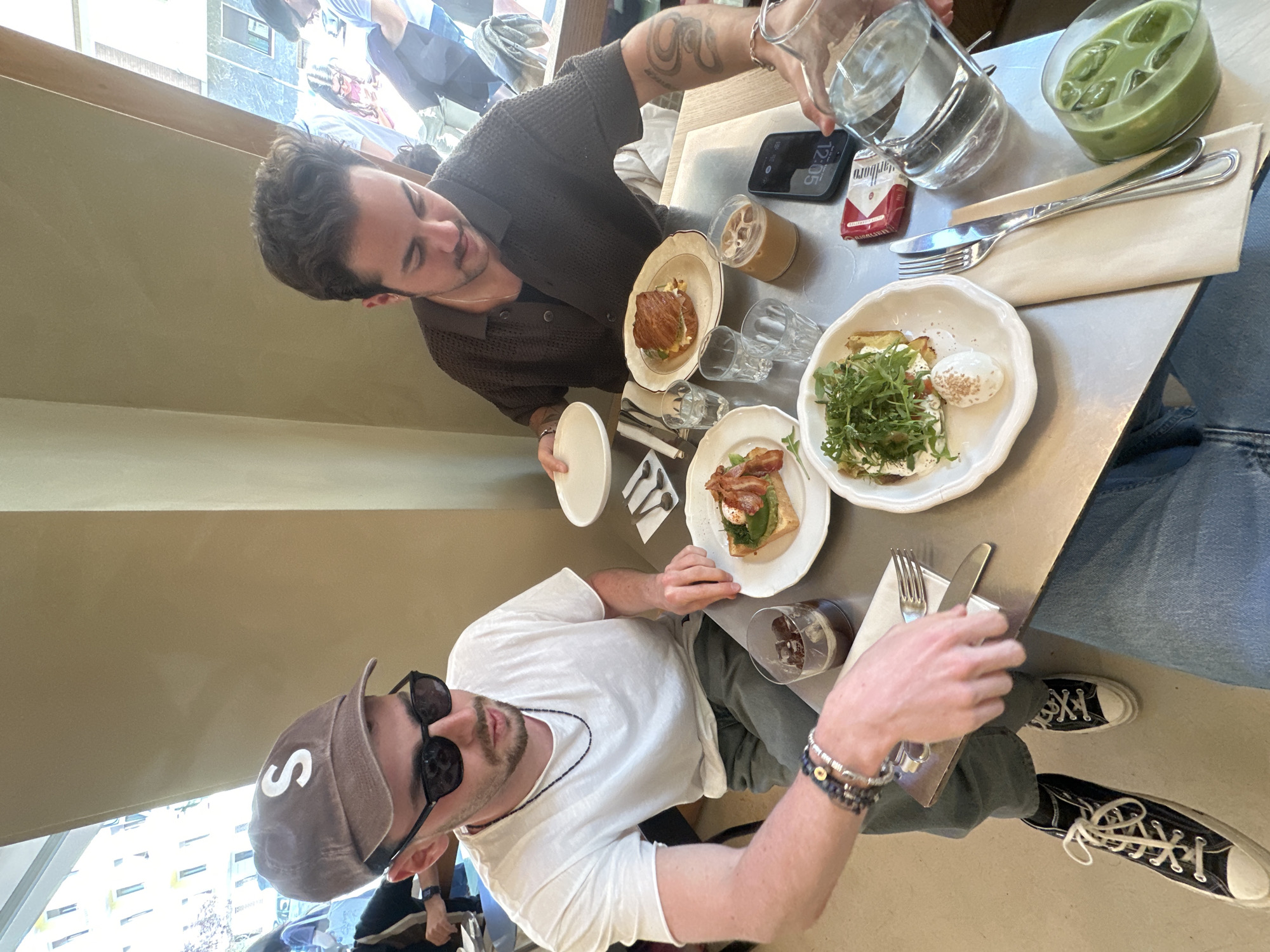 Two men share breakfast meal in Milan