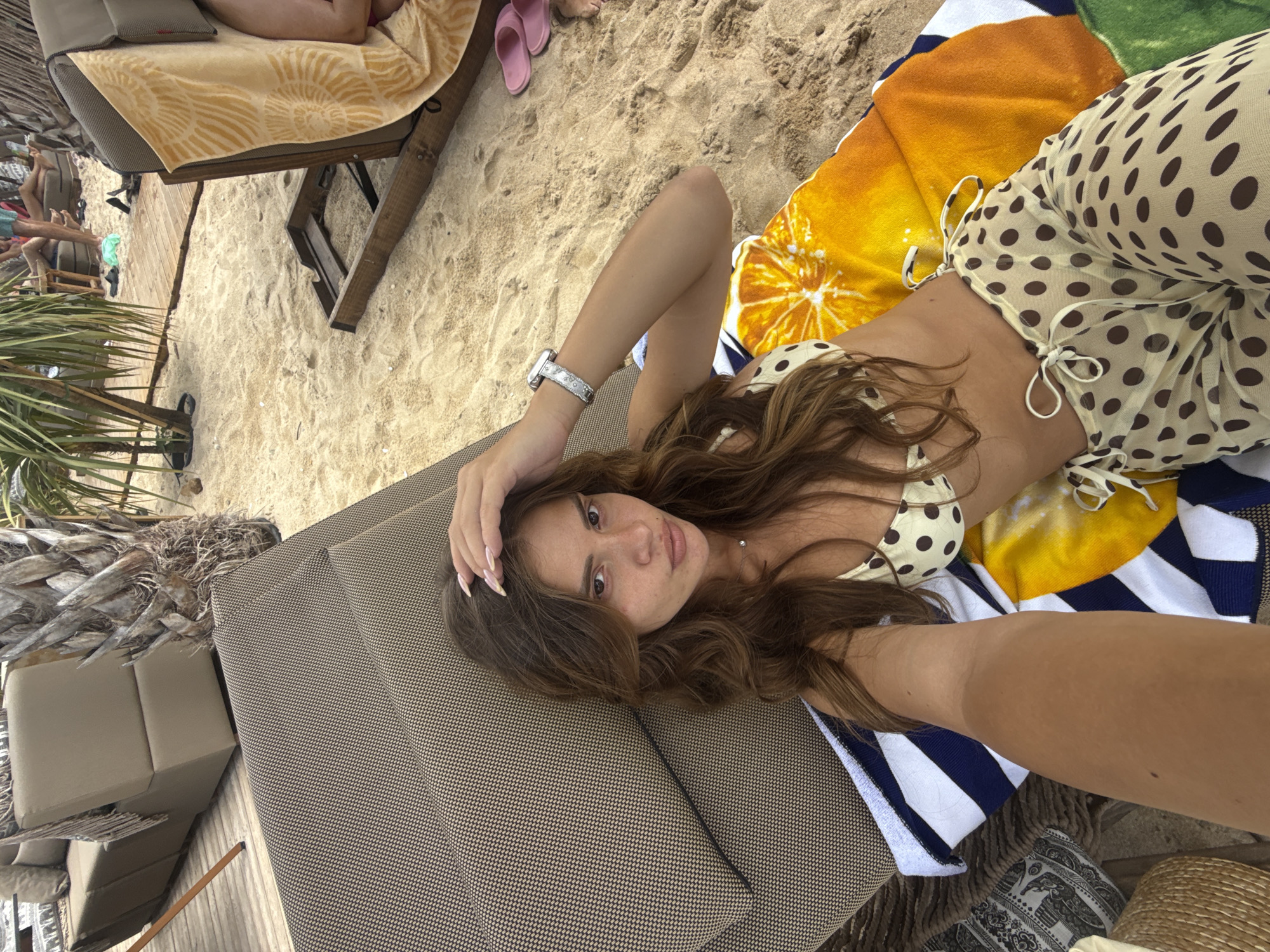 Relaxing on a sun lounger at Ofrynio Beach, Greece