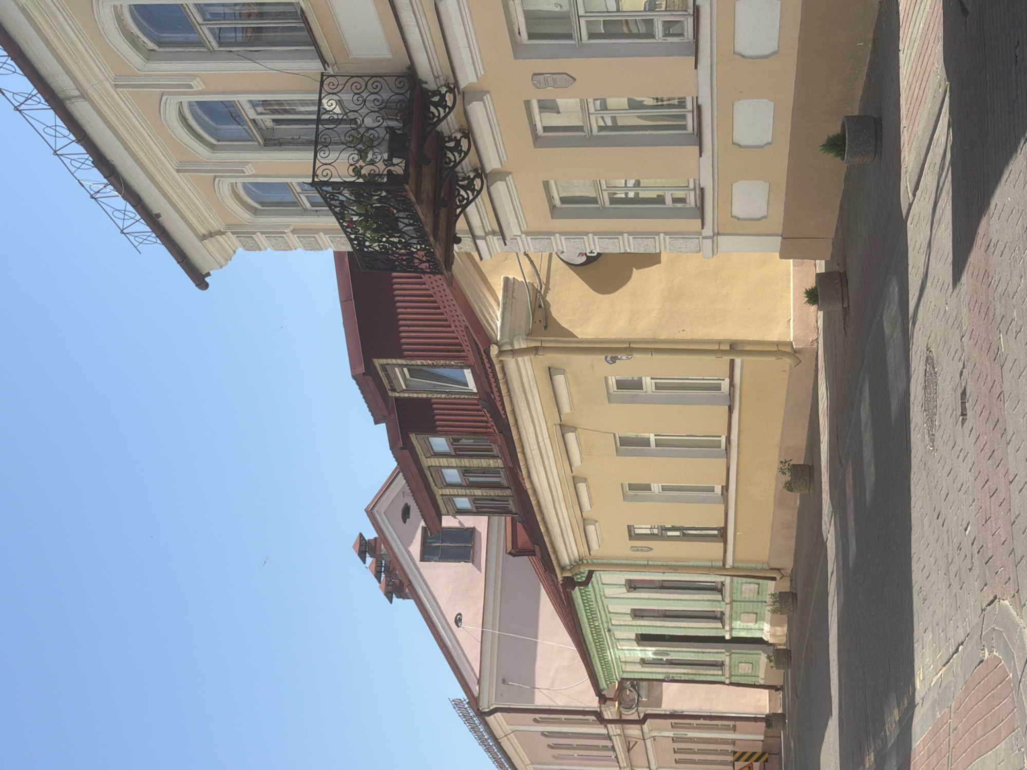 Street-level views of European-style architecture and cobblestone streets