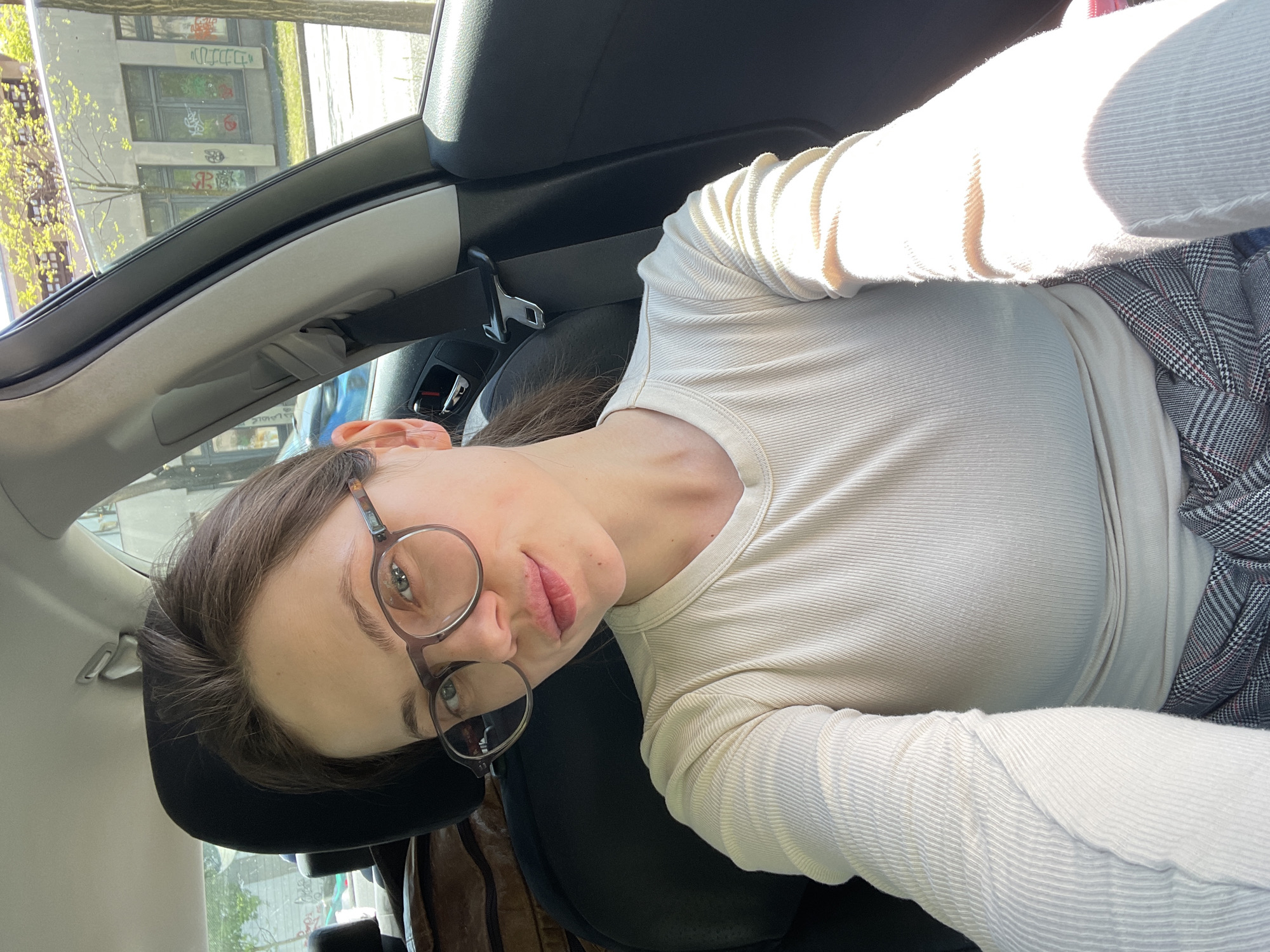 Woman takes selfie inside car in Budapest