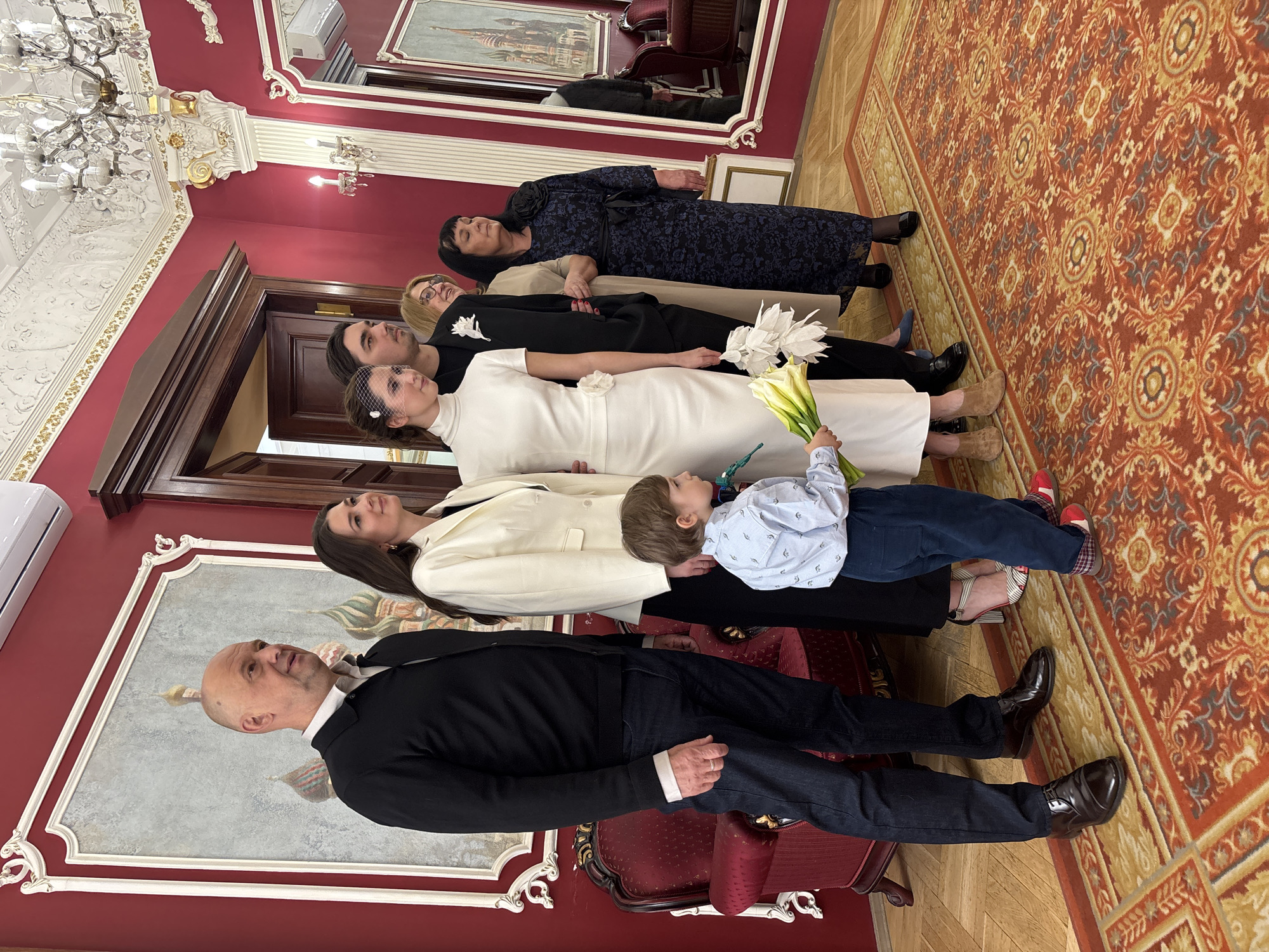 Formal gathering documented in ornate Moscow interior space