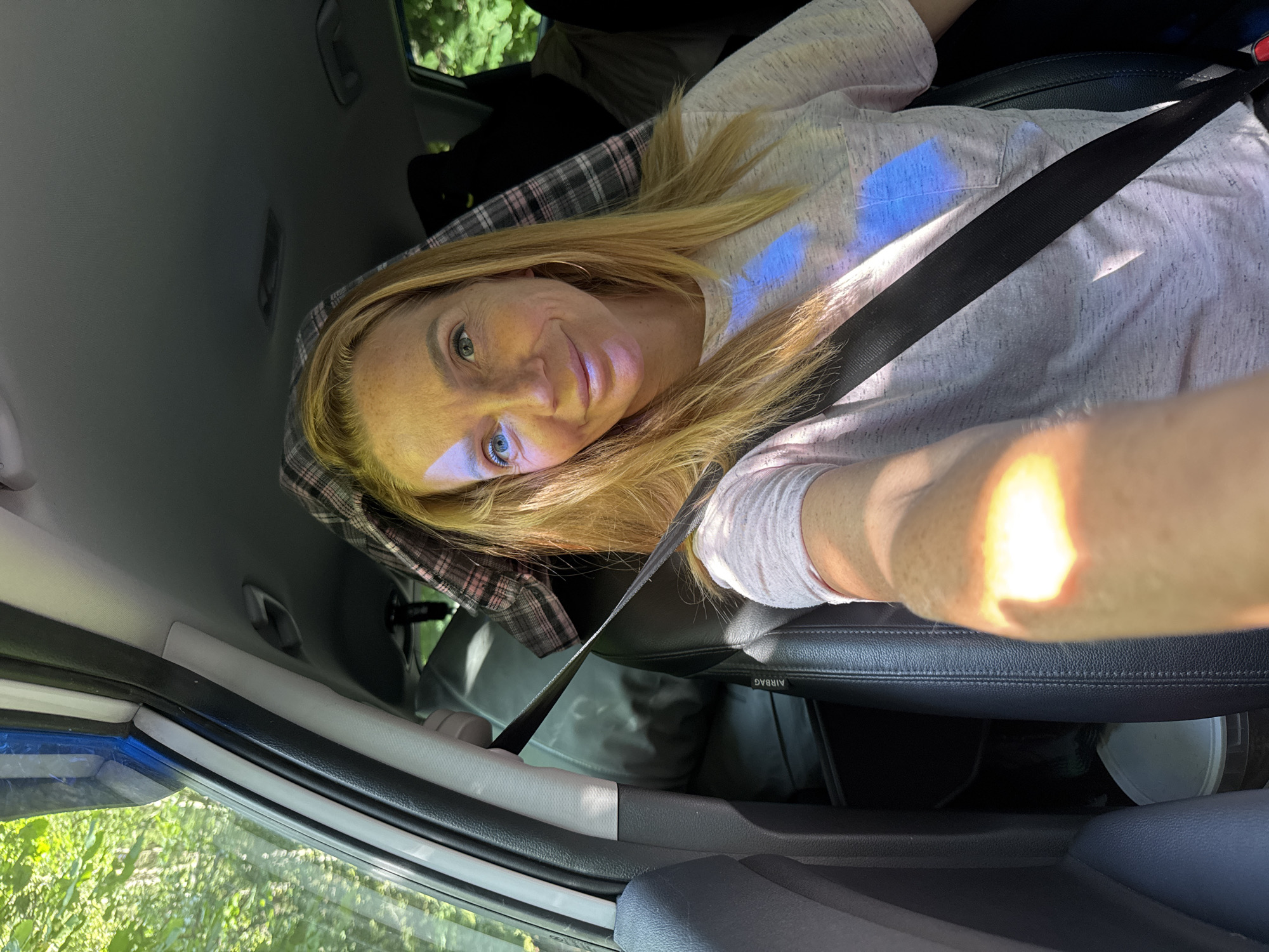 Passenger seat selfies in sunlit car, Portovoe