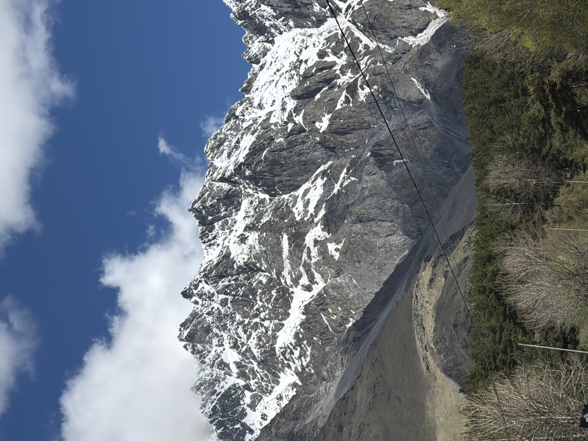 Snow-capped mountain with rocky face observed near Stepantsminda, Georgia