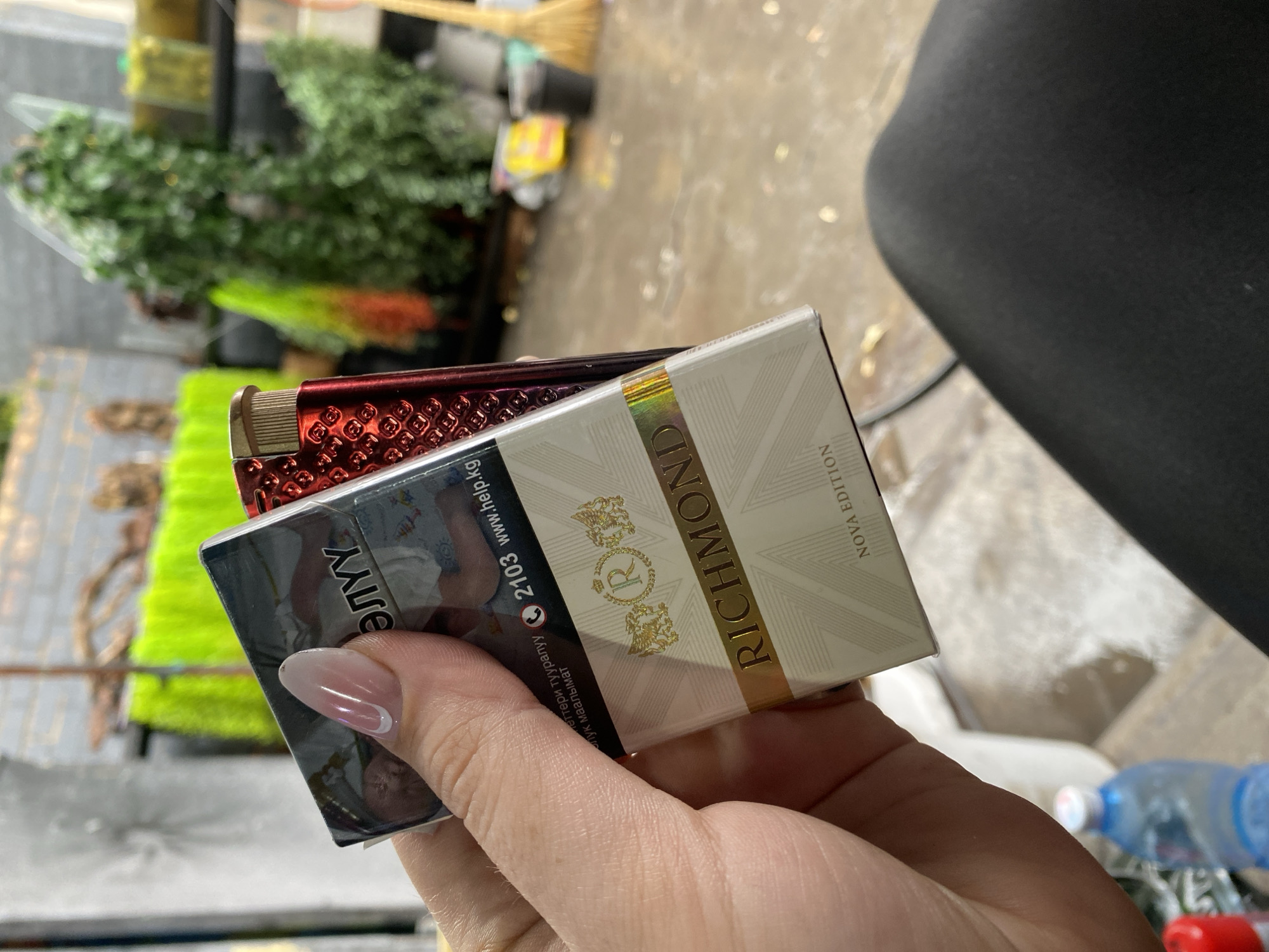 Quiet Bishkek morning: cigarettes, wet pavement, and aquarium fish.
