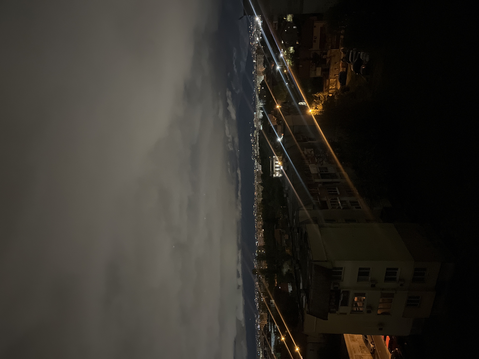 Witness captures nighttime panoramic view of cloudy Sofia skyline