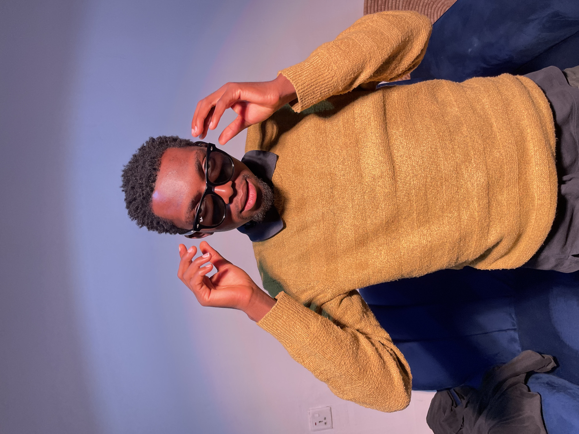 Man with sunglasses captured in casual indoor moments