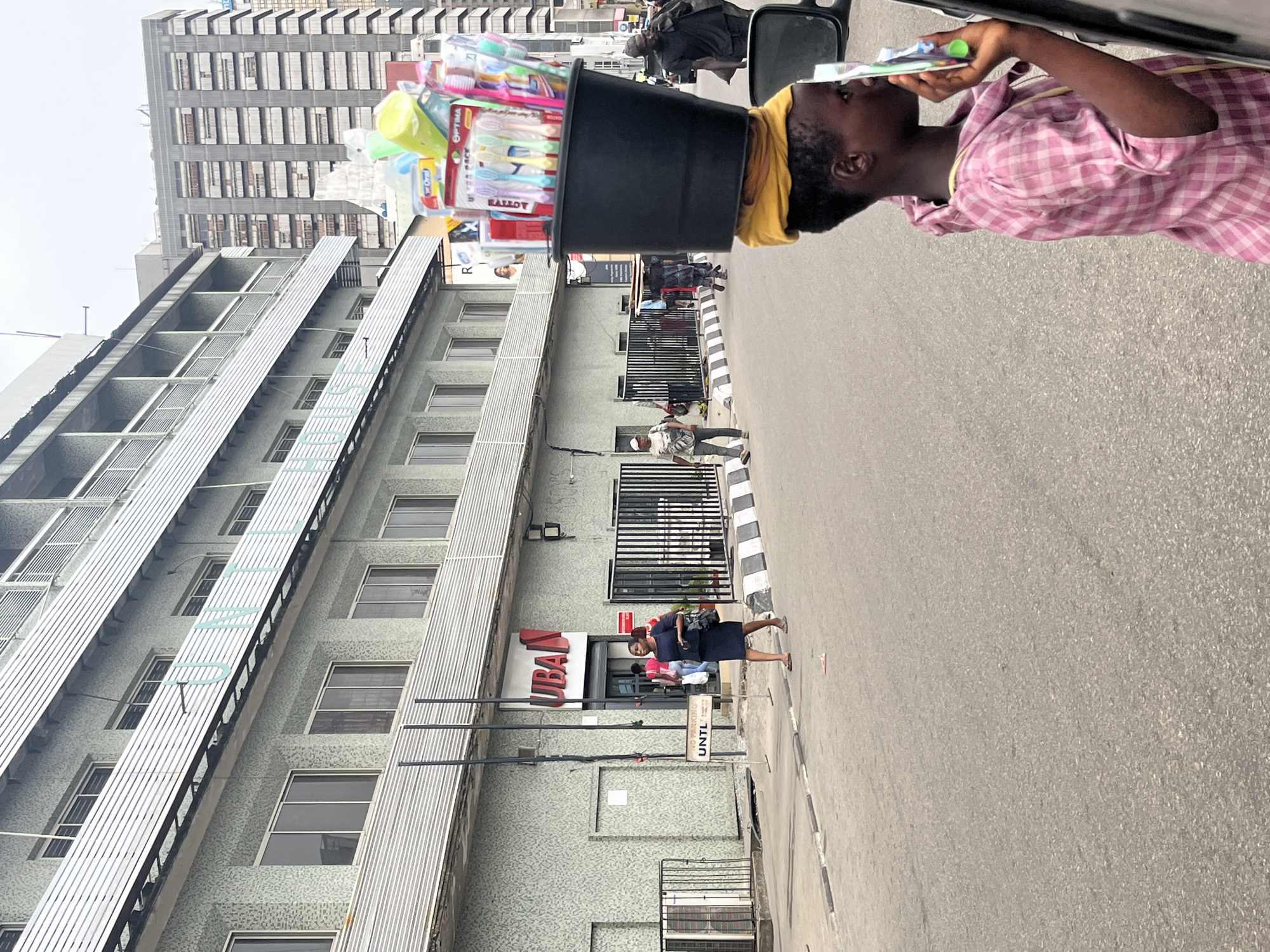 Daily street life captured around Lagos bank branch
