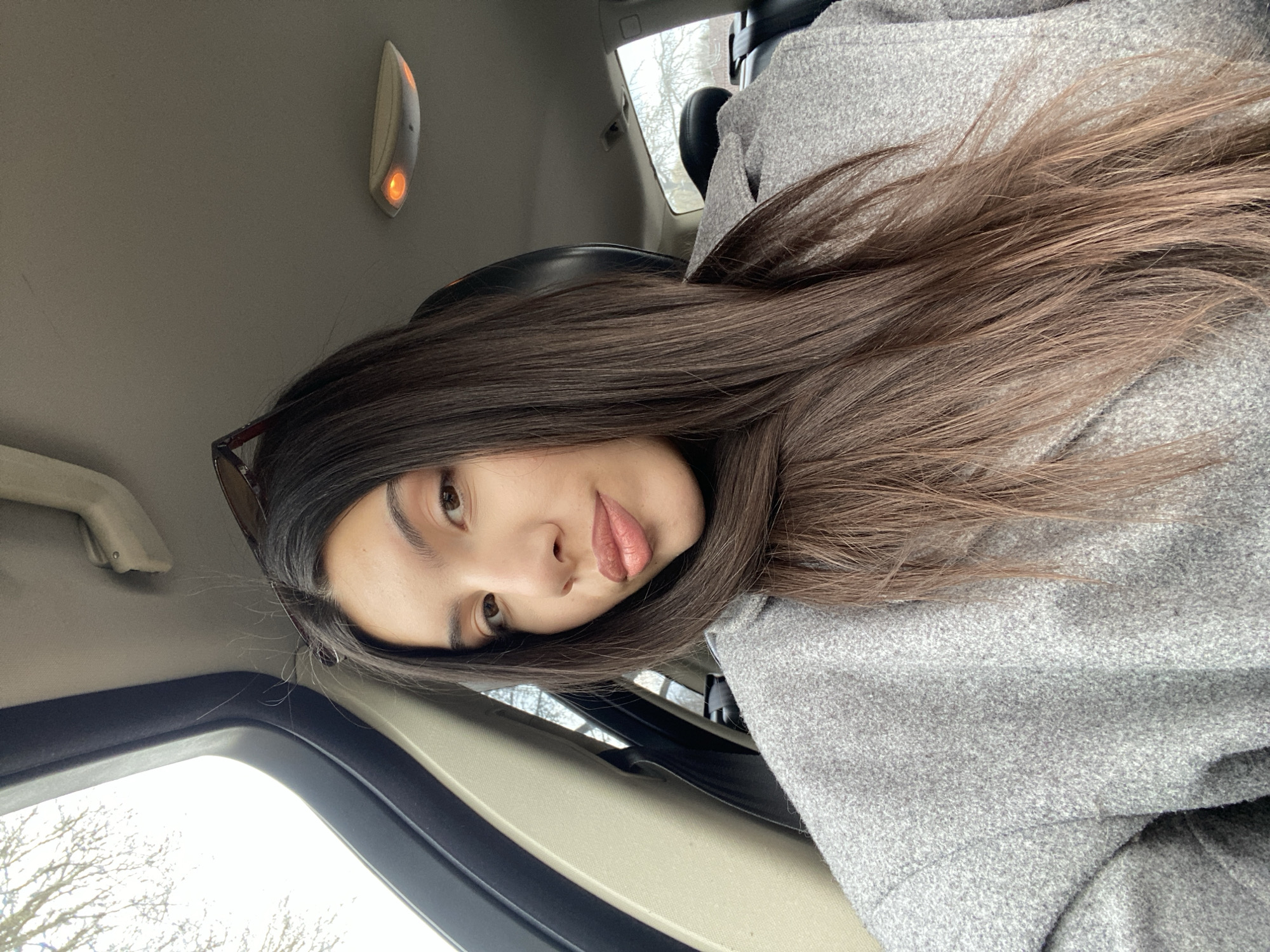 Woman photographed inside car in Bälinge, Sweden