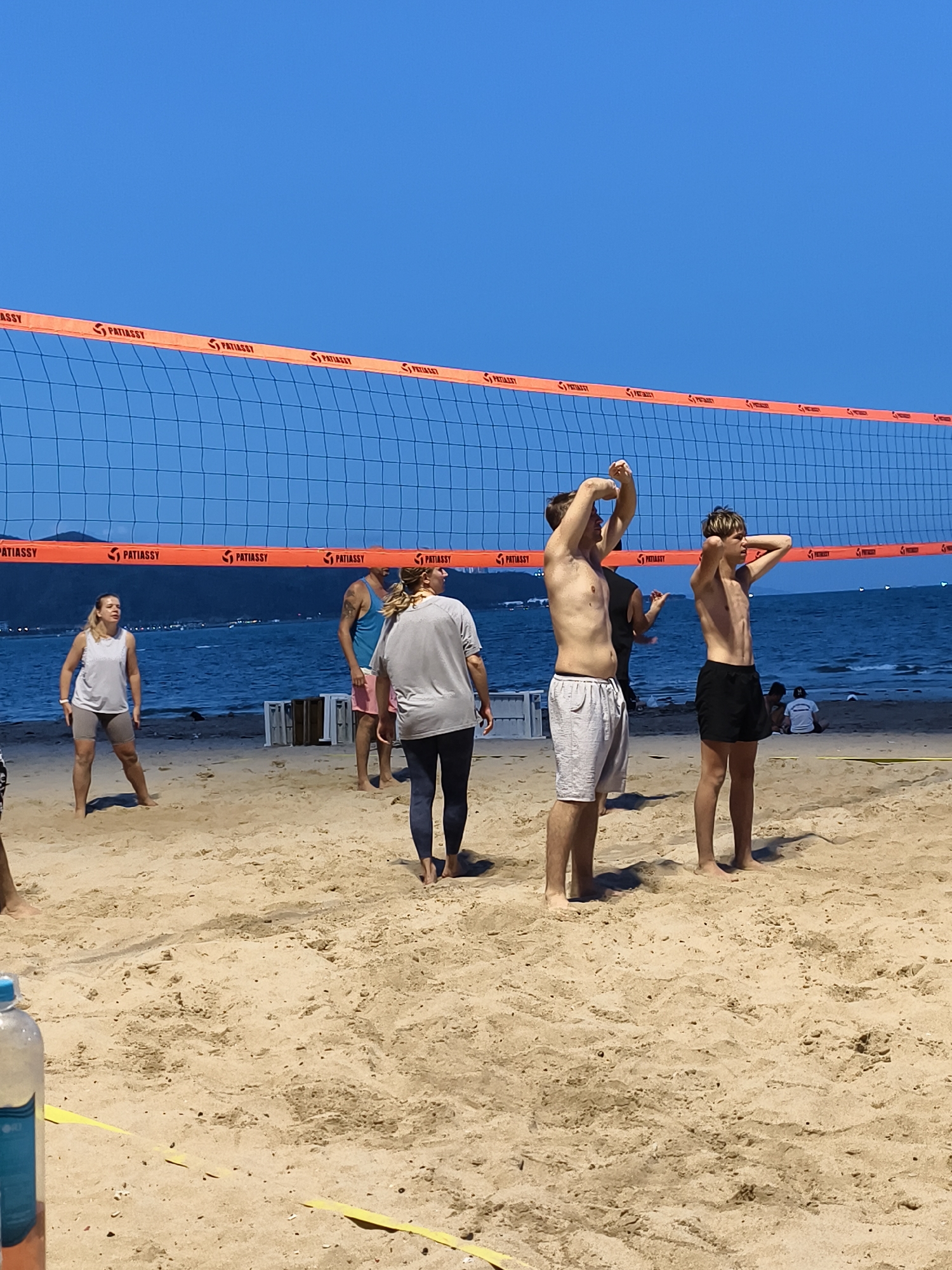 Daily life moments captured: beach volleyball, Buddha statue, dental visit