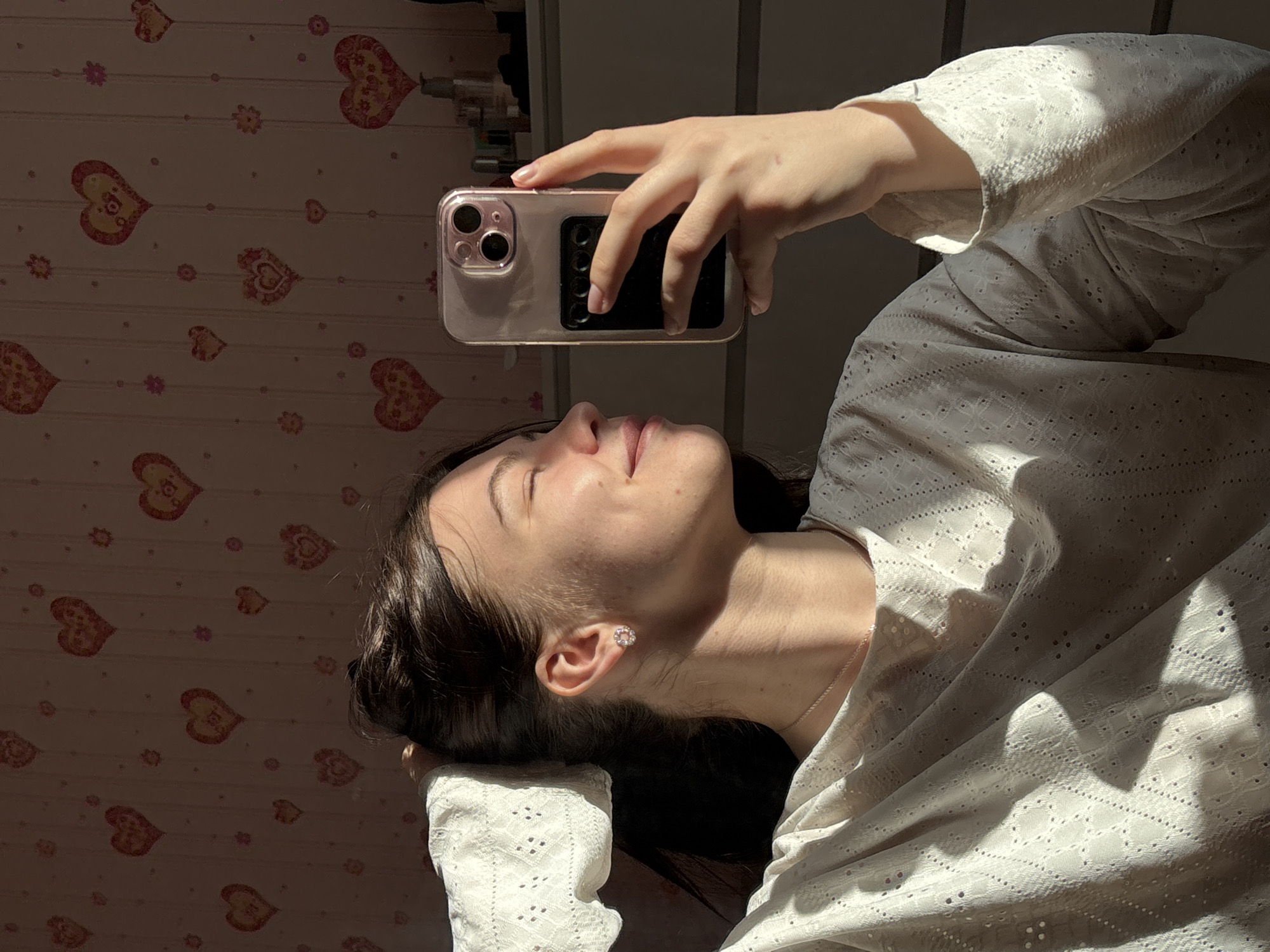 Woman photographed with smartphone in Perm interior spaces