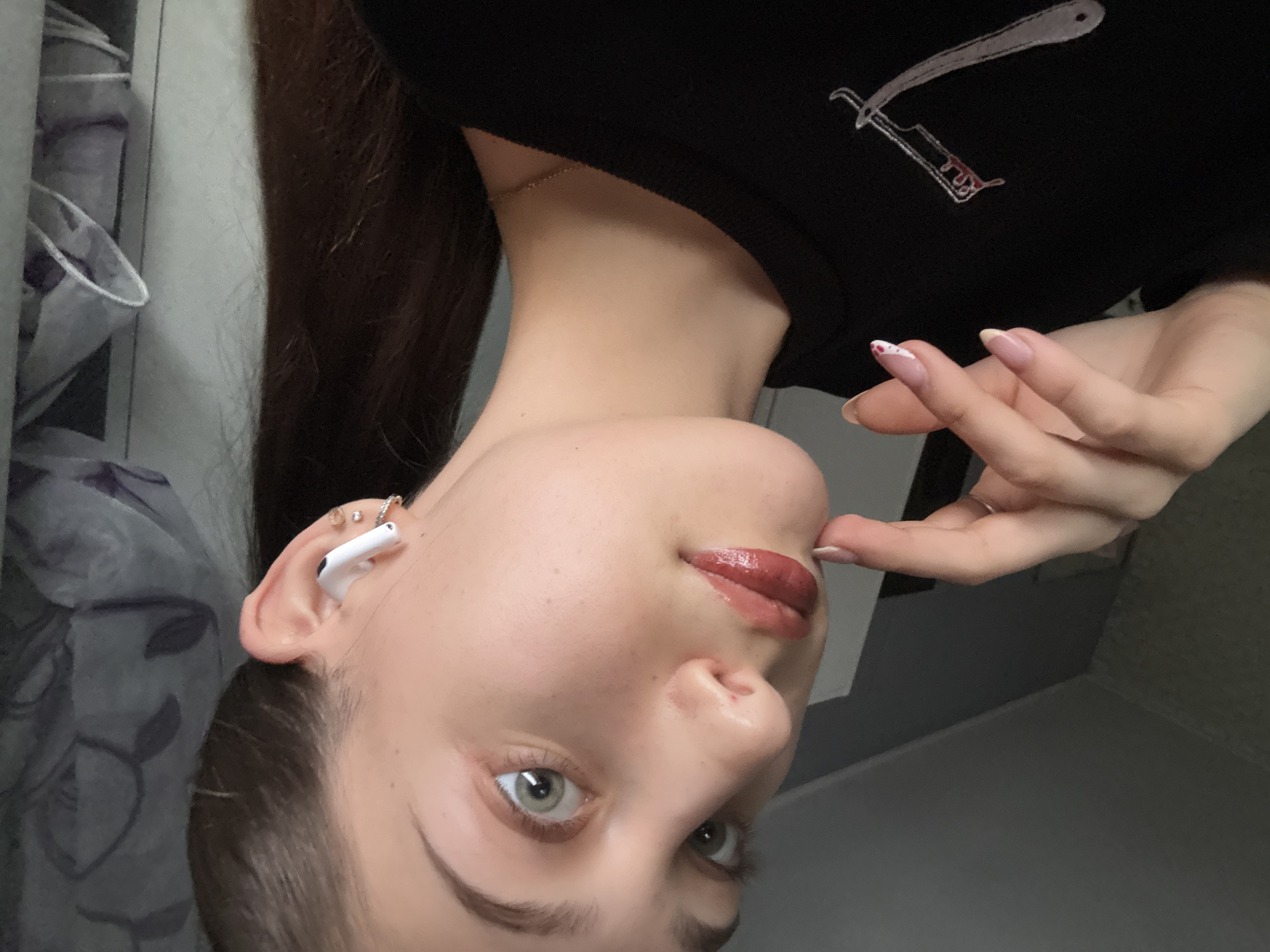 Woman takes selfies in Sofia apartment Friday afternoon
