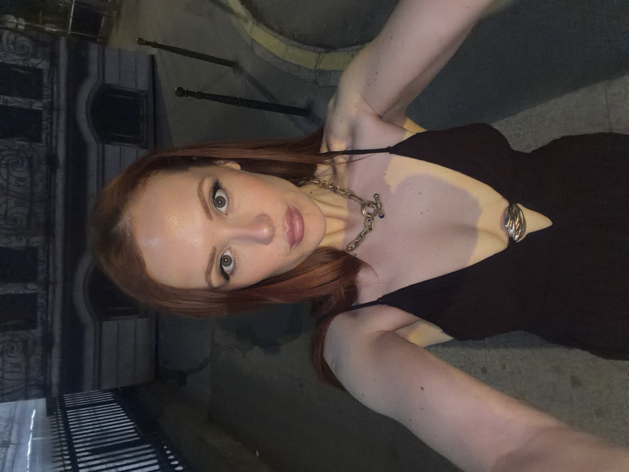 Woman documents nighttime selfie session on Champs-Élysées