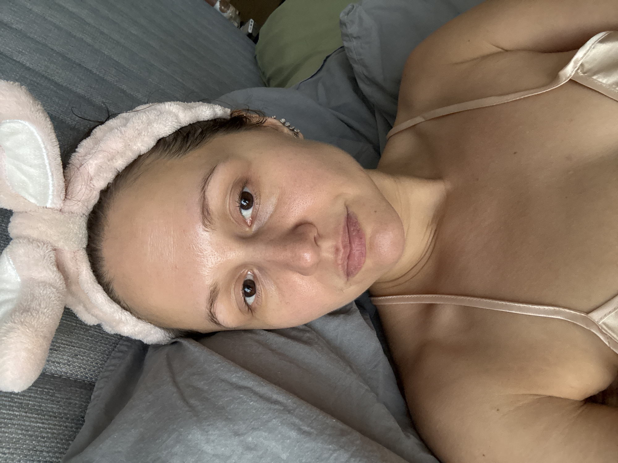 Woman in bunny ears, pajamas documented in Dubai bedroom